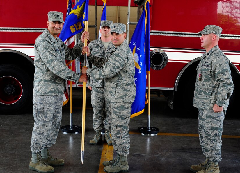 U. S. Air Force Lt. Col. Sergio J. Vega, Jr. assumes command of the 612th Air Base Squadron at Soto Cano Air Base, Honduras by accepting the guidon from U. S. Air Force Col. Jonathan R. VanNoord, the 612th Theater Operations Group commander, June 5, 2014. Vega assumed command from outgoing commander U. S. Air Force Lt. Col. Ray P. Matherne.  The 612th Air Base Squadron provides air base support to Joint Task Force-Bravo and 12th Air Force including air traffic control, logistics, base civil engineering, fire department, airfield operations and personnel functions.  In addition, the squadron maintains Soto Cano Air Base as the United States' only strategic gateway to Central America for United States Southern Command.  (Photo by Martin Chahin)