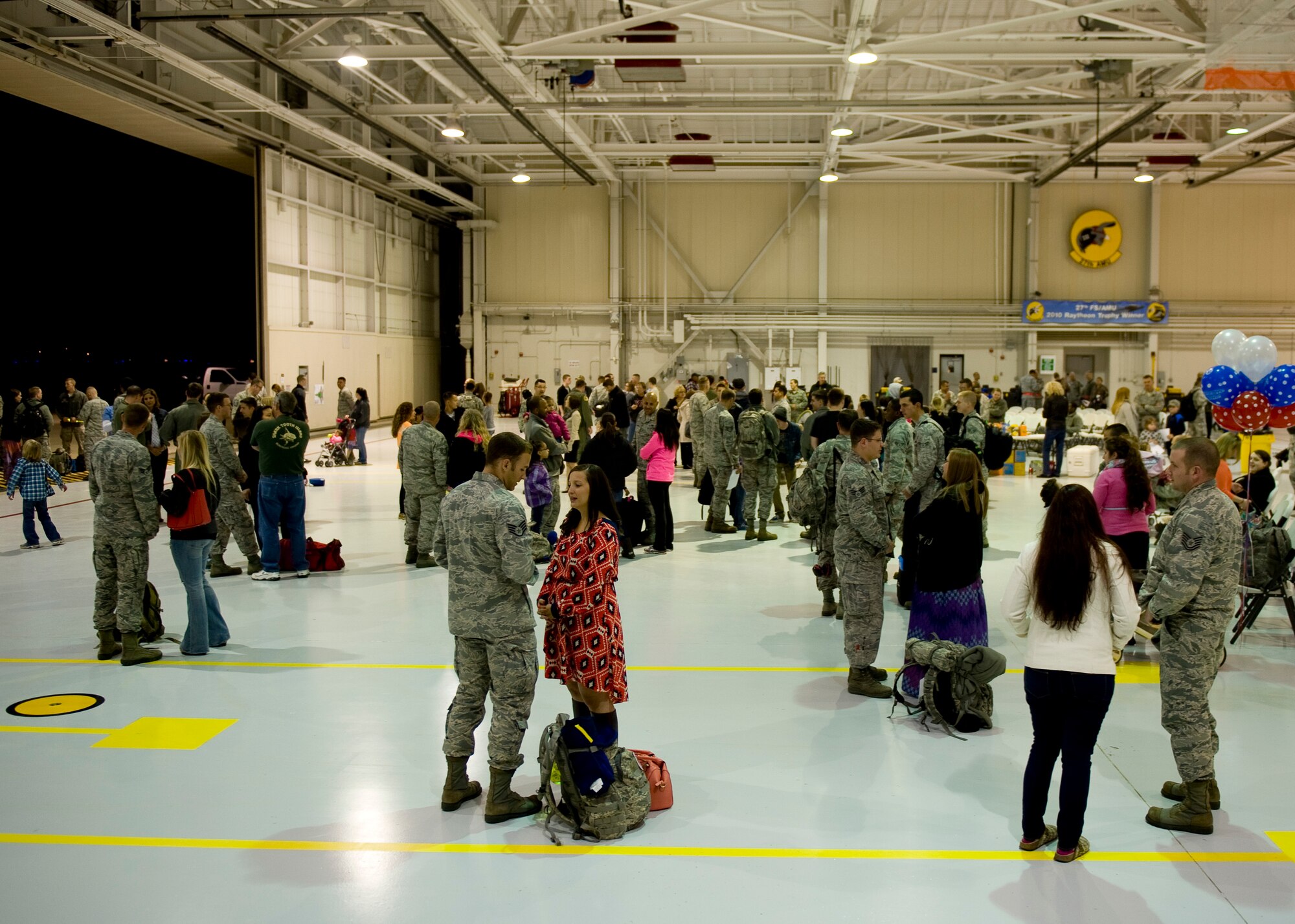 Airmen from the 192nd Fighter Wing Air National Guard are greeted by friends and families at Langley Air Force Base, Va., April 18, 2014.  More than 40 Airmen from the 192nd and 300 from the 1st Fighter Wing Squadron deployed to Kadena Air Base, Japan, to provide stability and security while allowing units to integrate with U.S. and Japanese forces. (U.S. Air Force photo by Staff Sgt. John D. Strong II/Released)

