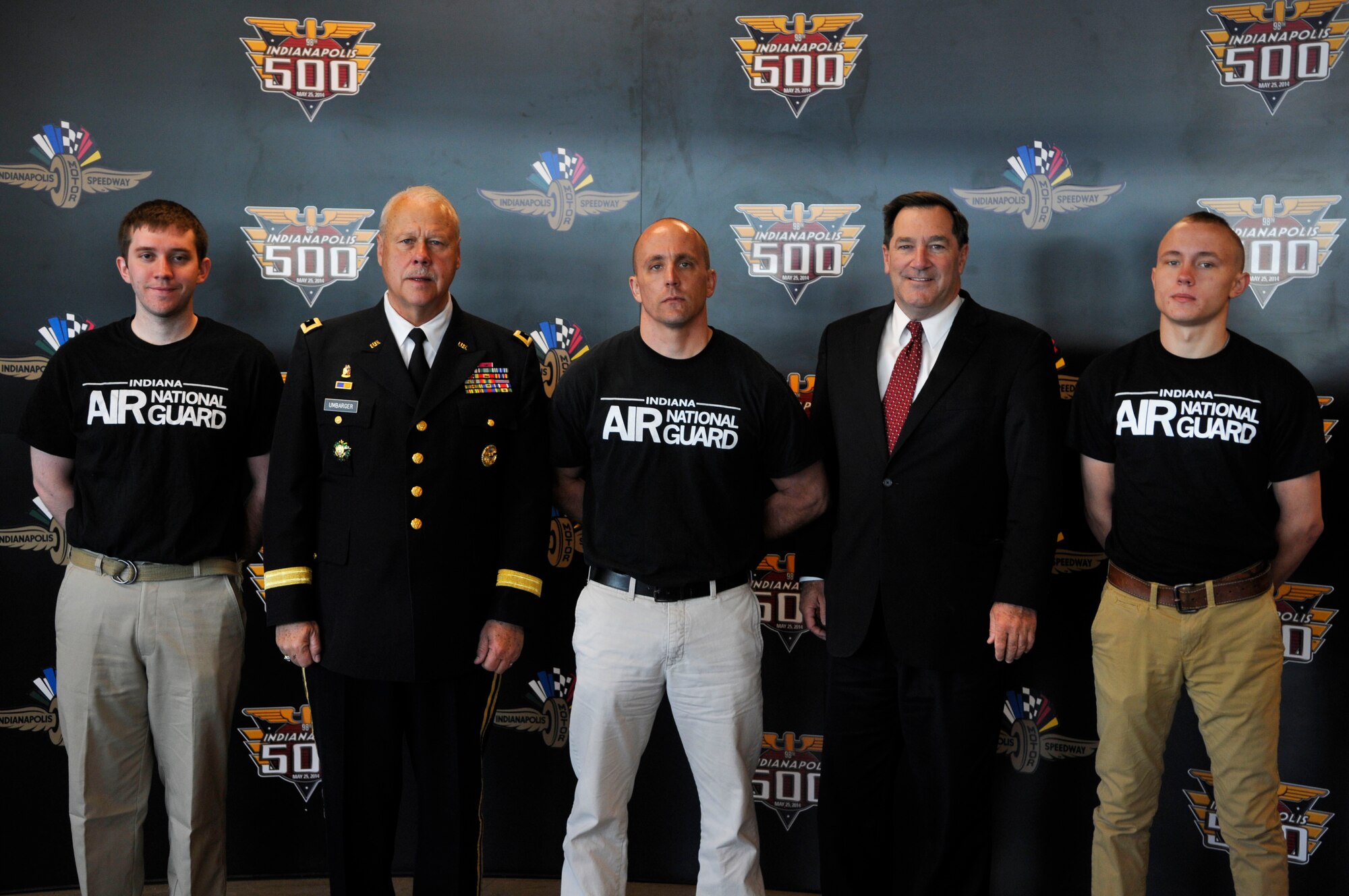 Trainees Timothy Barr (left), Patrick Affolder (center) and Taylor Affolder (right) from the 122nd Fighter Wing, Fort Wayne Air National Guard Base, pose with Senator Joe Donnelly and Maj. General R. Martin Umbarger, the Adjutant General of Indiana on May 18,2014 at the Indianapolis Motor Speedway. Statewide military recruits were in attendance for a mass enlistment ceremony held annually at the speedway during Armed Forces Weekend. (Air National Guard photo by Airman 1st Class Justin Andras/Released)