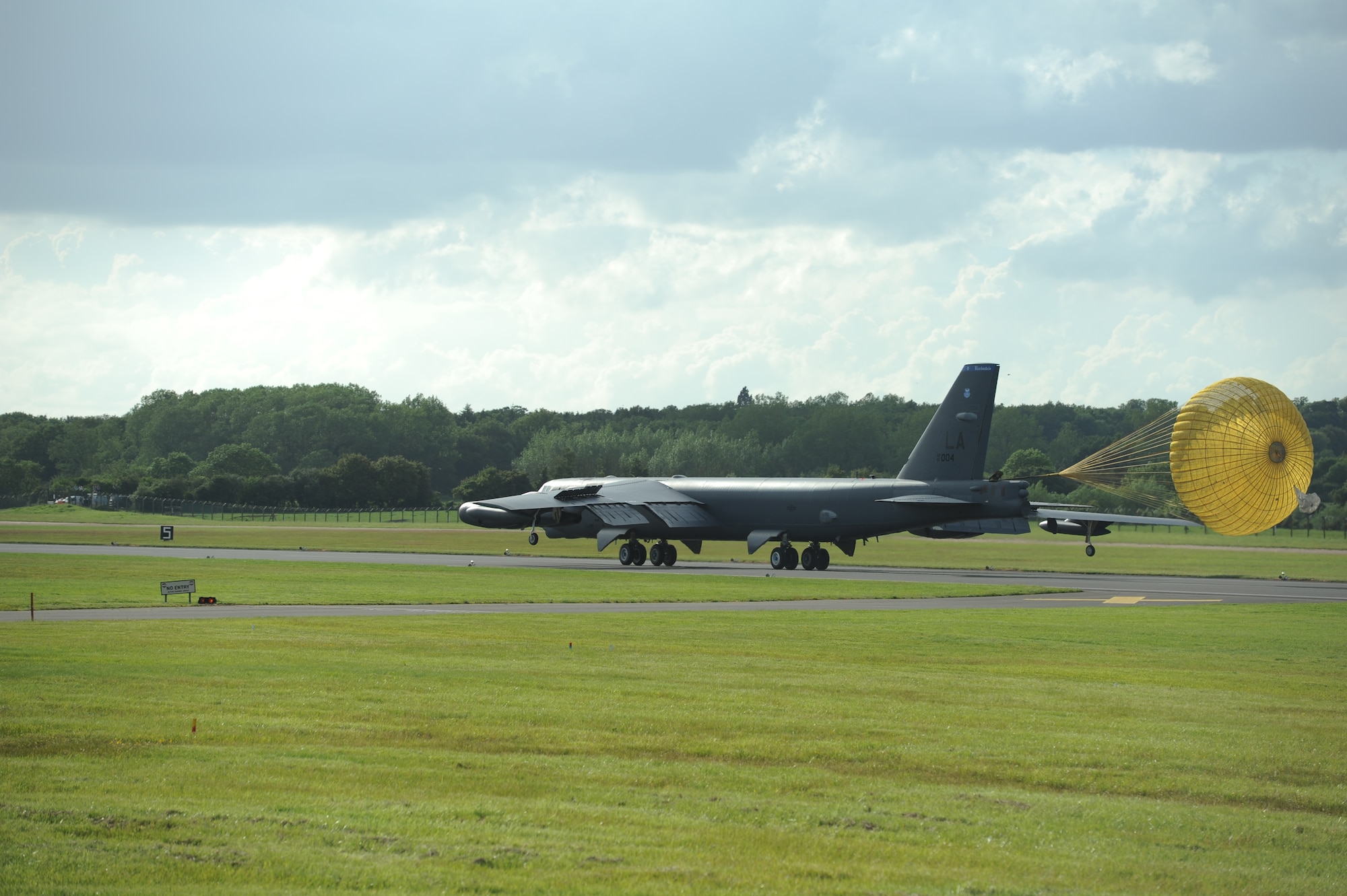 A B-52 Stratofortress from Air Force Global Strike Command lands at Royal Air Force Base Fairford, United Kingdom, June 7, 2014. Seventy years ago, Eighth Air Force supported a planned Allied invasion at Normandy with strategic heavy bombers and fighters during D-Day on June 6, 1944. The B-52 flew over Normandy to honor those Service members who fought and gave the ultimate sacrifice that day. (U.S. Air Force photo by Staff Sgt. Nick Wilson/Released)