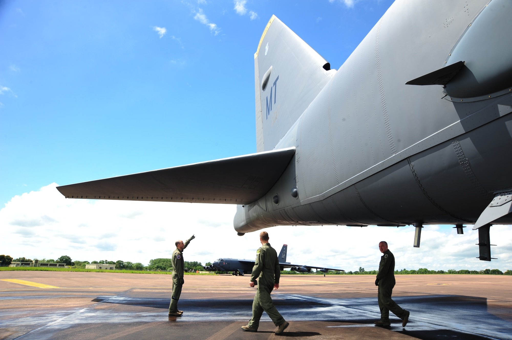 Maj. Steve Miracle, Capt. Andrew Paulsen and Capt. Rylan Kabanuck, B-52 Stratofortress crewmembers from the 5th Bomb Wing, Minot Air Force Base, N.D., perform a visual inspection on the tail of a B-52 at Royal Air Force Base Fairford, United Kingdom, June 7, 2014. The B-52 Stratofortress is a long-range, heavy bomber that can perform a variety of missions. The bomber is capable of flying at high subsonic speeds at altitudes up to 50,000 feet. (U.S. Air Force photo by Staff Sgt. Nick Wilson/Released)