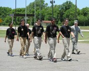 Recruits practice marching with 2nd Lt. Christopher Sullivan, 2nd Bomb Wing Public Affairs officer, on Barksdale Air Force Base, La., June 7, 2014. To help ease the transition from civilian to military life, personnel from the 2nd and 307th Bomb Wings educated recruits on what to expect at Air Force Basic Military Training. (U.S. Air Force photo/Senior Airman Benjamin Gonsier)