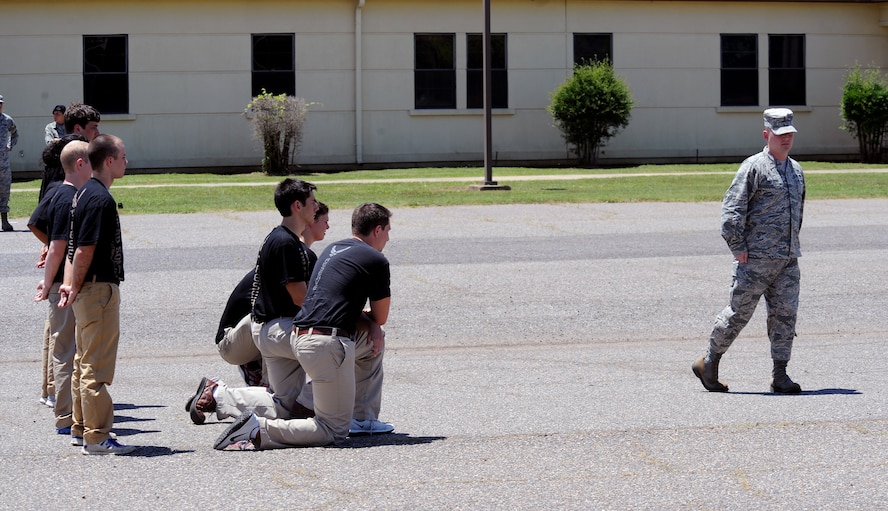 2nd Lt. Christopher Sullivan, 2nd Bomb Wing Public Affairs officer, demonstrates a facing movement to recruits on Barksdale Air Force Base, La., June 7, 2014. To help ease the transition from civilian to military life, personnel from the 2nd and 307th Bomb Wings educated recruits on what to expect at Air Force Basic Military Training. (U.S. Air Force photo/Senior Airman Benjamin Gonsier)