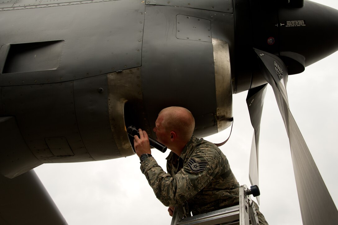 U.S. Air Force Staff Sgt. Christopher Becker, propulsion specialist, 934th Airlift Wing, Minneapolis Air Reserve Station, Minn., performs an intake and exhaust inspection on an engine of a C-130H Hercules aircraft during Maple Flag in Edmonton/Cold Lake, Alberta, Canada, May 26, 2014. Maple Flag is an international exercise designed to enhance the interoperability of C-130 aircrews, maintainers and support specialists in a simulated combat environment. (U.S. Air Force photo by Tech. Sgt. Matthew Smith/Released)