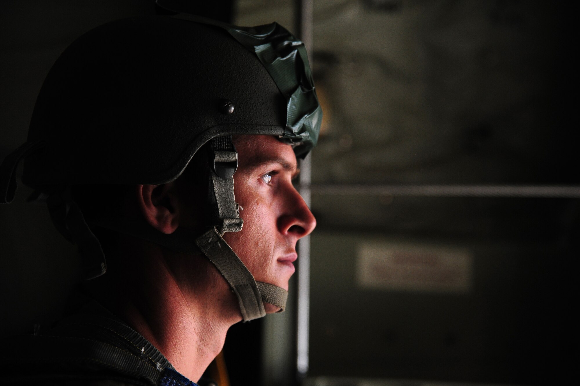 A paratrooper from the U.S. Army National Guard’s 20th Special Forces Group waits for jump approval during a friendship jump over Jordan June 2, 2014, during Exercise Eager Lion. The United States’ participation in exercises like Eager Lion highlights commitment to promoting security, stability and mutual interests in the region. (U.S. Air Force photo by Staff Sgt. Brigitte N. Brantley/Released)