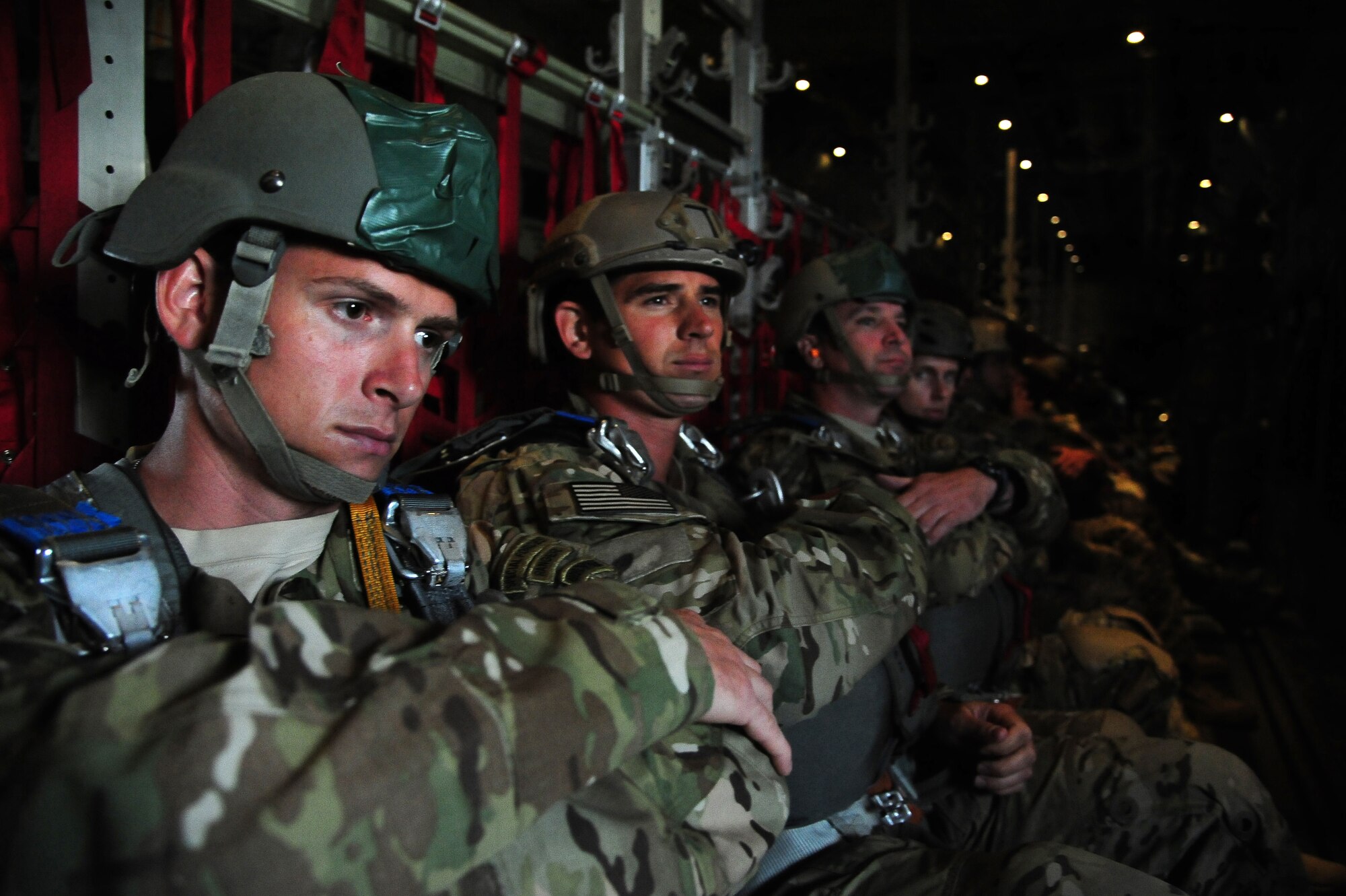 Paratroopers from the U.S. Army National Guard’s 20th Special Forces Group await their turn during a friendship jump June 2, 2014, over Jordan during Exercise Eager Lion. Working alongside fellow jumpers from countries including Jordan, Australia, Pakistan, Italy, France and more gave the Soldiers a chance to standardize the way they operate.  (U.S. Air Force photo by Staff Sgt. Brigitte N. Brantley/Released)