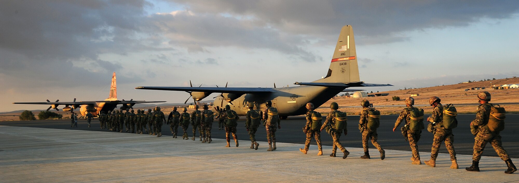 Paratroopers from various countries load onto a C-130J Hercules in preparation for a friendship jump June 2, 2014, during Exercise Eager Lion at an air base in Jordan. Strengthening the relationship between special operations forces is one of the many ways countries enhance their interoperability during multinational exercises like Eager Lion. (U.S. Air Force photo by Staff Sgt. Brigitte N. Brantley/Released)