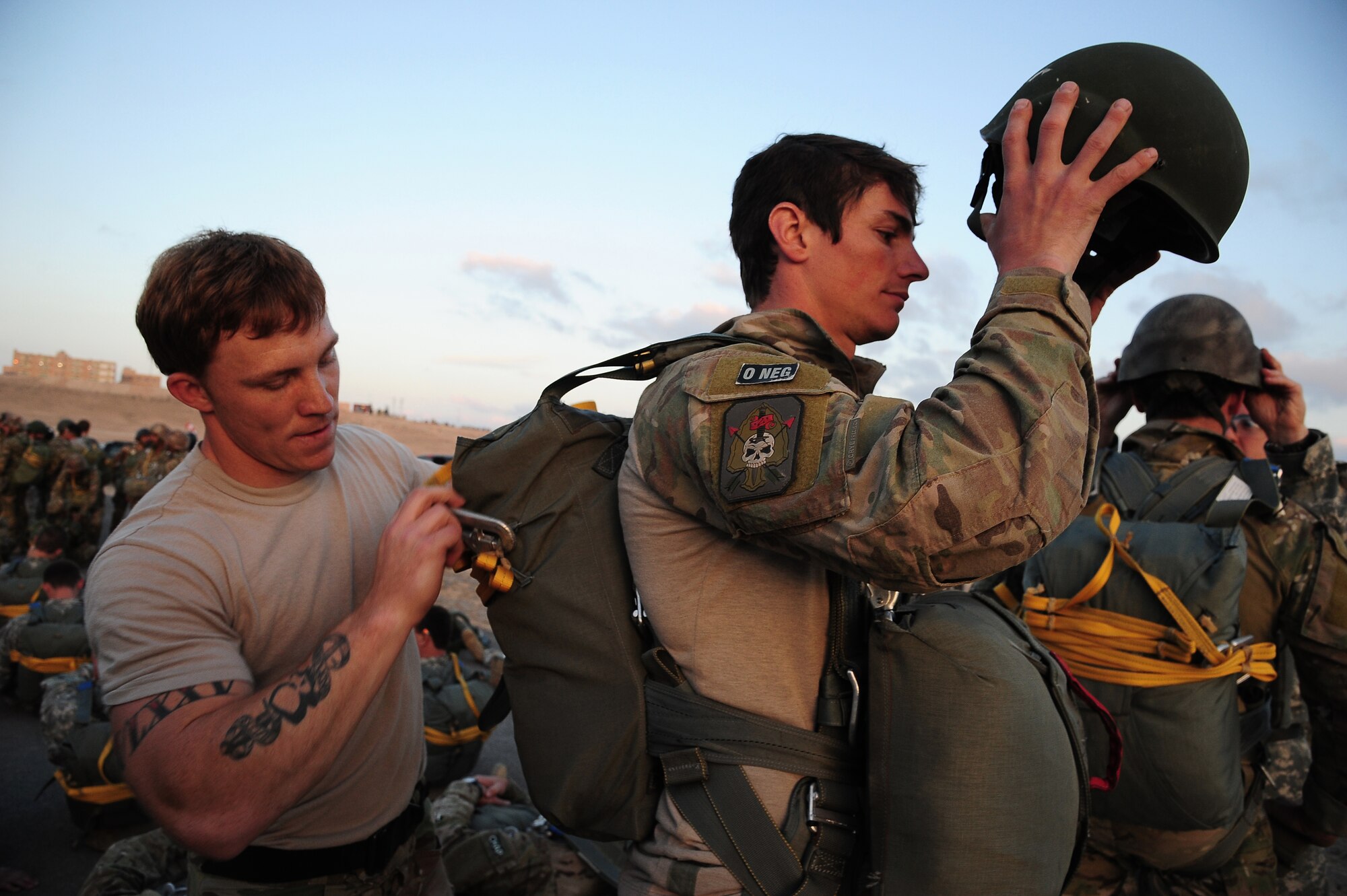 U.S. Army Capt. Peter Fritz, left, a jumper with the Army National Guard’s 20th Special Forces Group, checks the parachute of a Canadian Special Operations Forces member before a friendship jump during Exercise Eager Lion June 2, 2014, at an air base in Jordan. One of the objectives of Eager Lion was to strengthen military-to-military relationships at all levels. (U.S. Air Force photo by Staff Sgt. Brigitte N. Brantley/Released)