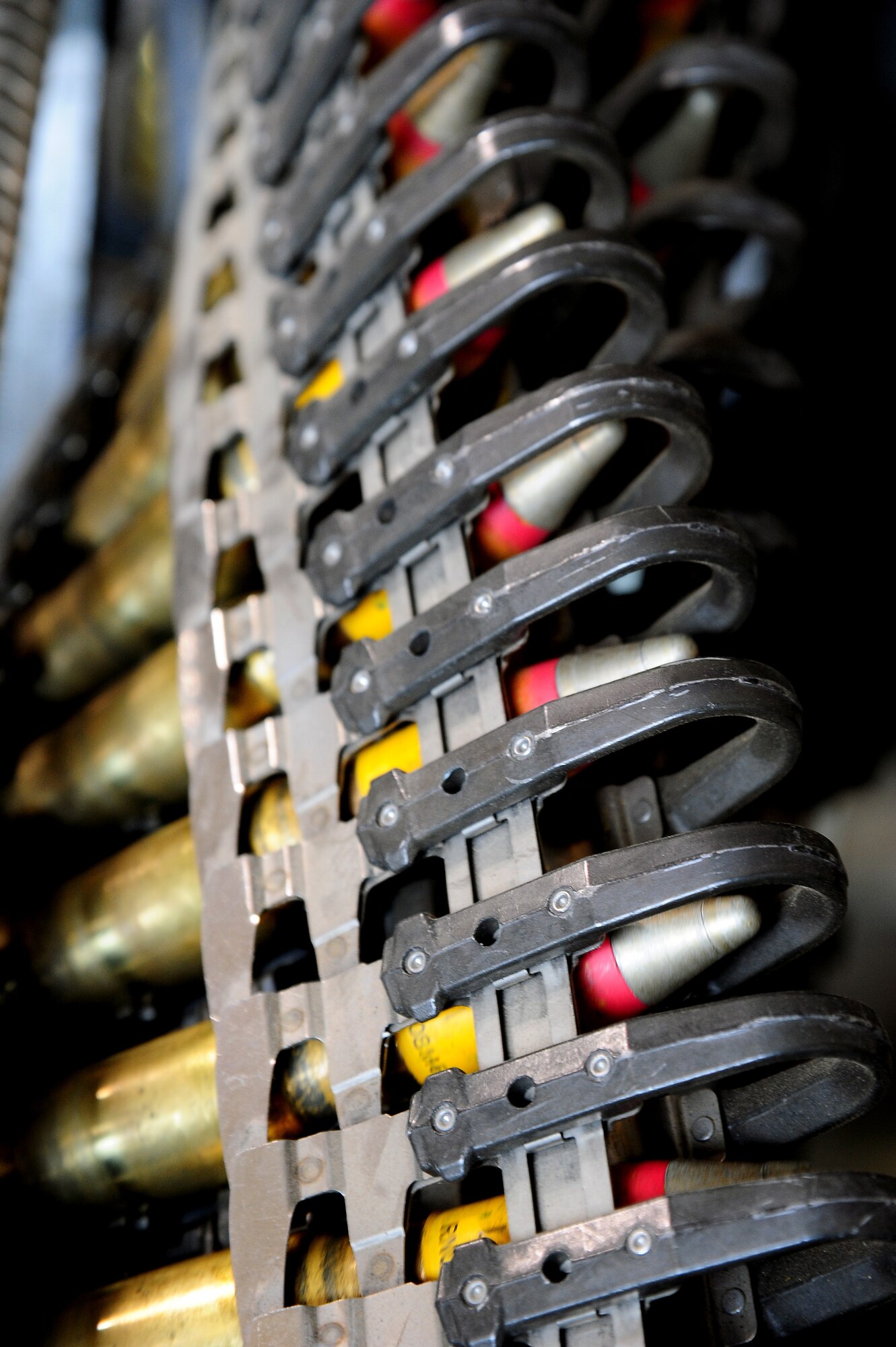 Multiple 20 mm high explosive incendiary rounds are loaded into a universal ammunition loading system by Airmen from the 35th Maintenance Squadron at Misawa Air Base, Japan, June 4, 2014, during Exercise Eager Lion at an air base in northern Jordan. Rounds similar to these were used during Eager Lion by F-16 Fighting Falcon aircraft from Misawa. (U.S. Air Force photo by Staff Sgt. Brigitte N. Brantley/Released)