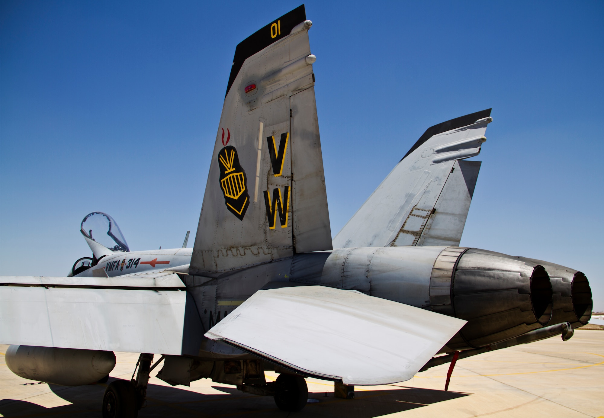 A U.S. Marine Corps F-18 Hornet from Marine Fighter Attack Squadron 314 at Marine Corps Air Station Miramar, Calif., awaits post-flight maintenance during Exercise Eager Lion June 1, 2014, at an air base in northern Jordan. Along with the F-18, other fighter aircraft including the F-16 Fighting Falcon also participated in this multinational exercise. (U.S. Air Force photo by Staff Sgt. Tyler McLain/Released)