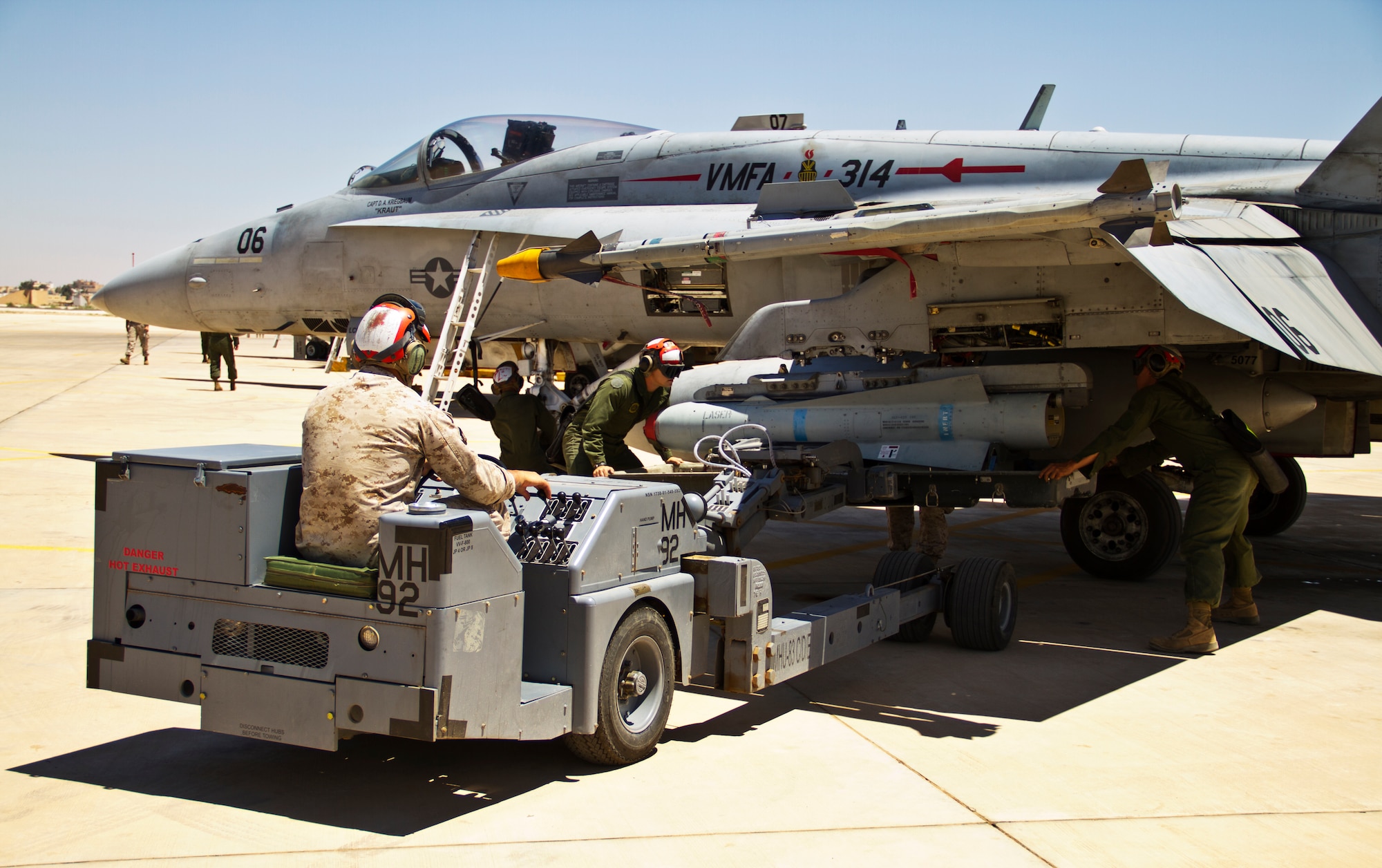 A U.S. Marine Corps F-18 Hornet from Marine Fighter Attack Squadron 314 at Marine Corps Air Station Miramar, Calif., is loaded with simulated weapons during Exercise Eager Lion June 1, 2014, at an air base in northern Jordan. Airpower played a vital role in the exercise, which also featured air, land and sea forces from the U.S. Air Force, Army and Navy. (U.S. Air Force photo by Staff Sgt. Tyler McLain/Released)