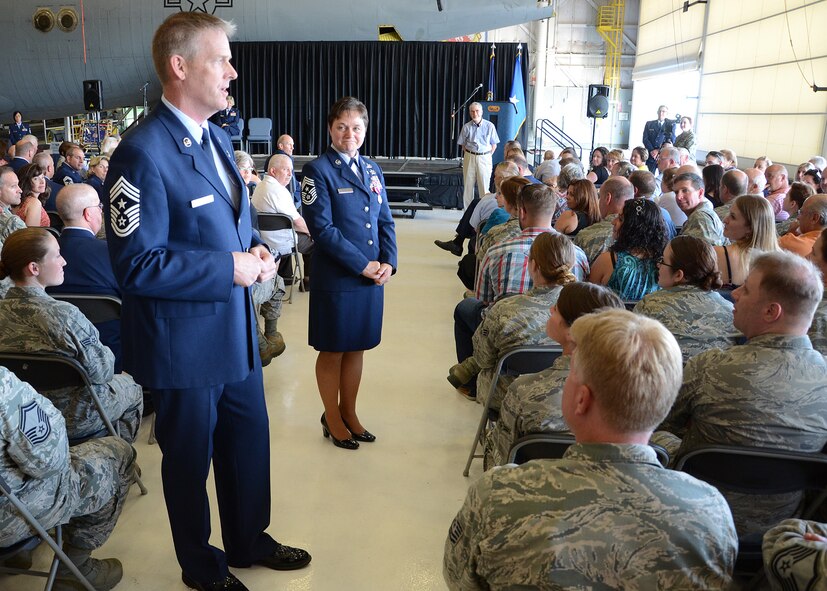 PEASE AIR NATIONAL GUARD BASE, N.H. -- New Hampshire Air National Guard Command Chief Master Sgt. Matthew Collier walks among members of the 157th Air Refueling Wing to highlight the impact Chief Master Sgt. Brenda Blonigen made on the wing during her time as the wing command chief and first sergeant at her retirement ceremony in Hanger 254 at Pease Air National Guard Base June 7. Blonigen retired after serving 34 years on active duty and in the N.H. Air National Guard. (U.S. Air Force photo by Tech. Sgt. Mark Wyatt)