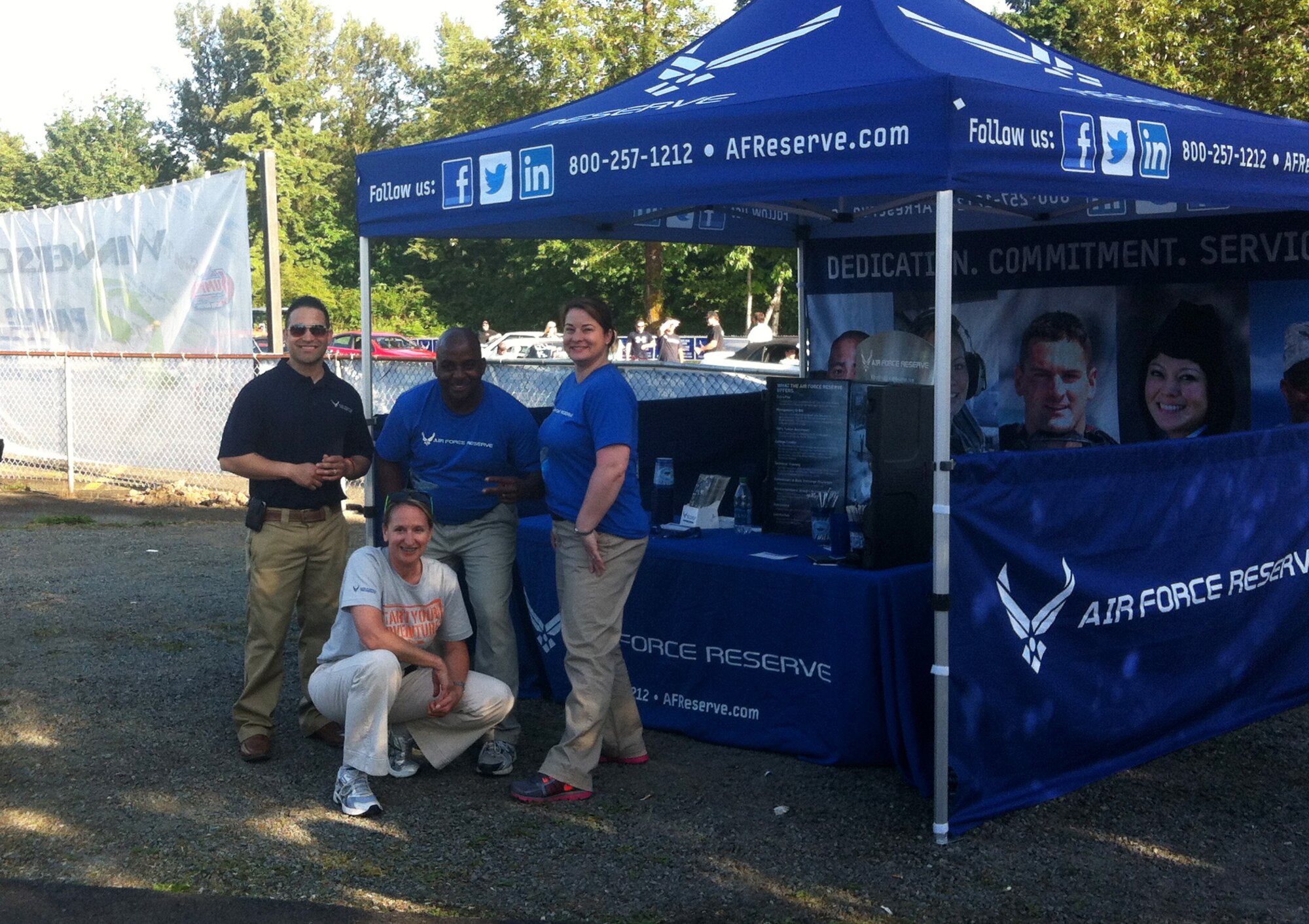 Chief Master Sgt. Kristyn Ervin (front), Chief of Recruiting for the 446th Airlift Wing Reserve Recruiting office, and fellow recruiters Tech. Sgt. Orlando Anduhar (left), Tech. Sgt. Warren Hill (middle) and Master Sgt. Kylie Kosta (right) pose for a photo June 6 at Pacific Raceways in Kent, Washington. High school students and parents in the local community learned about the Air Force Reserve and the 446th Airlift Wing during the National HotRod Association High School Drags event. Recruiters garnered 22 new leads after setting up an Air Force Reserve Recruiting booth. (Photo courtesy of Chief Master Sgt. Kristyn Ervin)