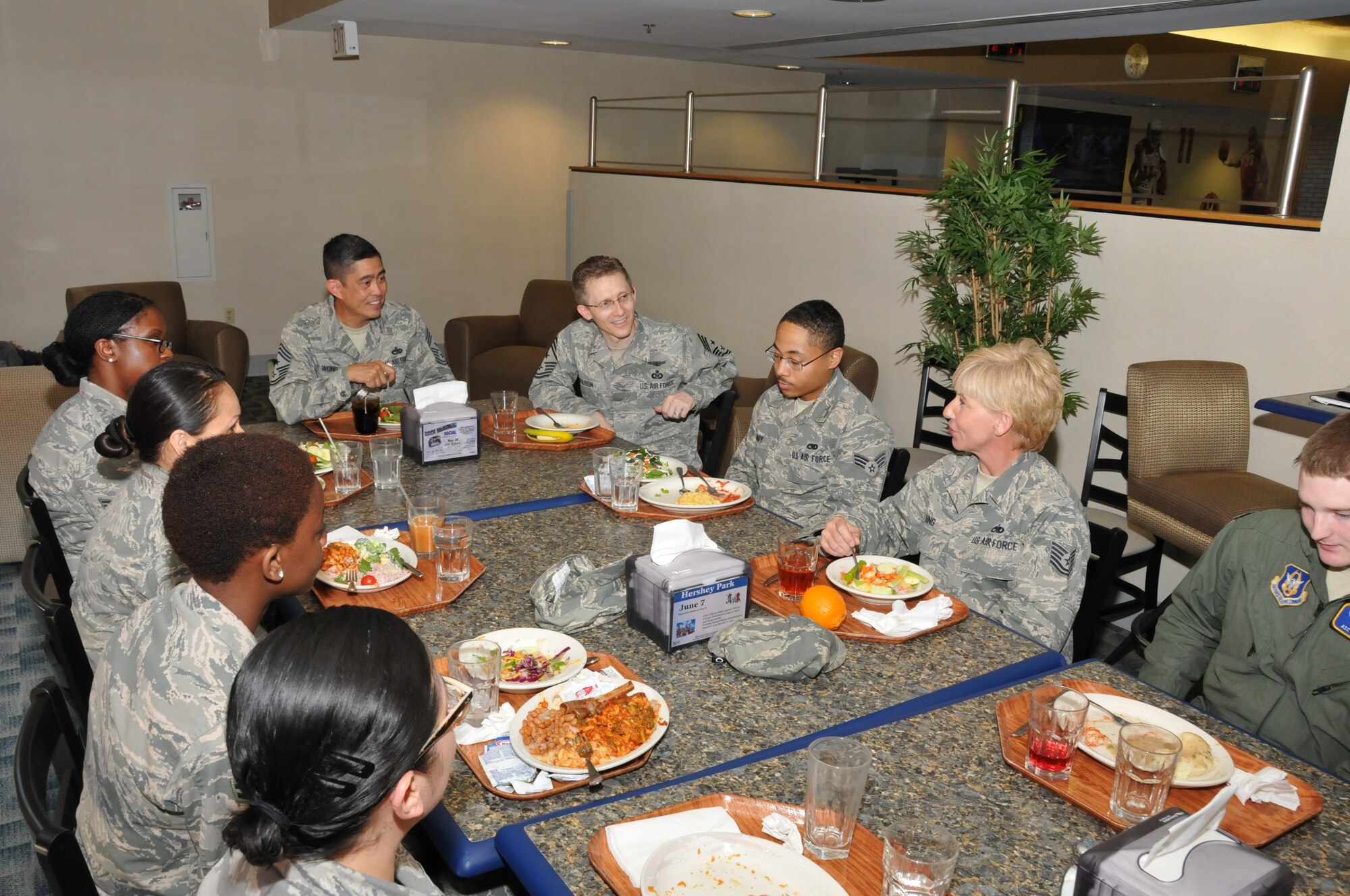 Chief Master Sgt. Brian Wong, 4th Air Force command chief, dines with Airmen from the 512th Airlift Wing during his visit to Dover Air Force Base, Del., June 8, 2014. Wong was interested in hearing process improvement ideas from the various units the Airmen represented. (U.S. Air Force photo/Staff Sgt. Mercedes Crossland)