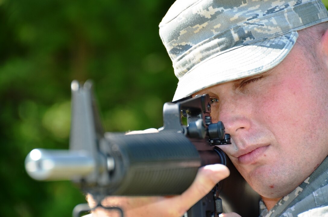 Maryland Air National Guardsman Senior Airman Evan Jones, electronic warfare pod technician, 175th Maintenance Squadron, displays his shooting technique with his M16 rifle at Warfield Air National Guard Base in Baltimore, Md. on June 8, 2014. He has been awarded the Air Force Distinguished Rifleman and Pistol Badges this year. (U.S. Air National Guard photo by Tech. Sgt. David Speicher/RELEASED)