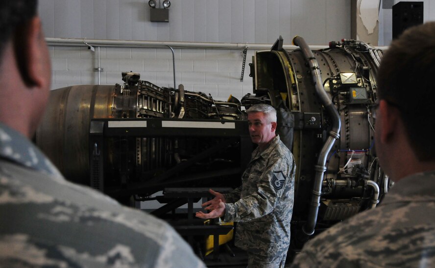 Airmen from the 161st Maintenance Group, gather Saturday morning for engine familiarization training taught by Tech. Sgt. Bill Ekadis, Phoenix, June 7, 2014. This F-108 engine has a 4:1 ratio, which means 80% of the passing air creates thrust via the fan and only 20% of the passing air exits the turbine. (U.S. Air Force Photo by Staff Sgt. Courtney Enos/Released)

