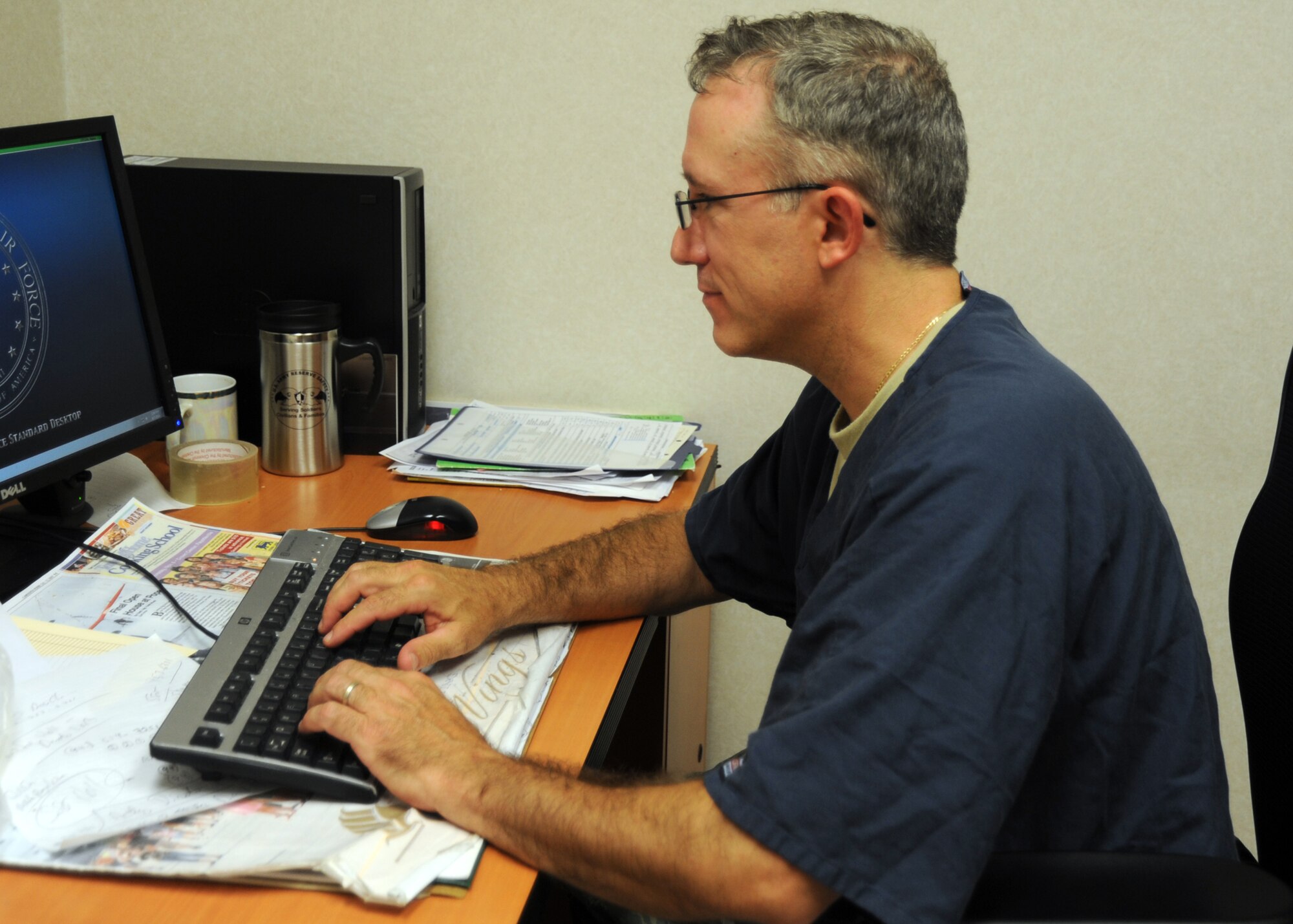 POPE ARMY AIRFIELD, N.C. – Maj. Michael Strohecker, 440th Medical Squadron dentist here, prepares to deploy in support of Tropic Care 2014 to Kauai, Hawaii. Tropic Care participants are seen on a first come, first serve basis and all services are free of charge, including dental care, basic health screening, eye care, and basic lab tests.  (U.S. Air Force photo by Tech. Sgt. Elizabeth Moody)