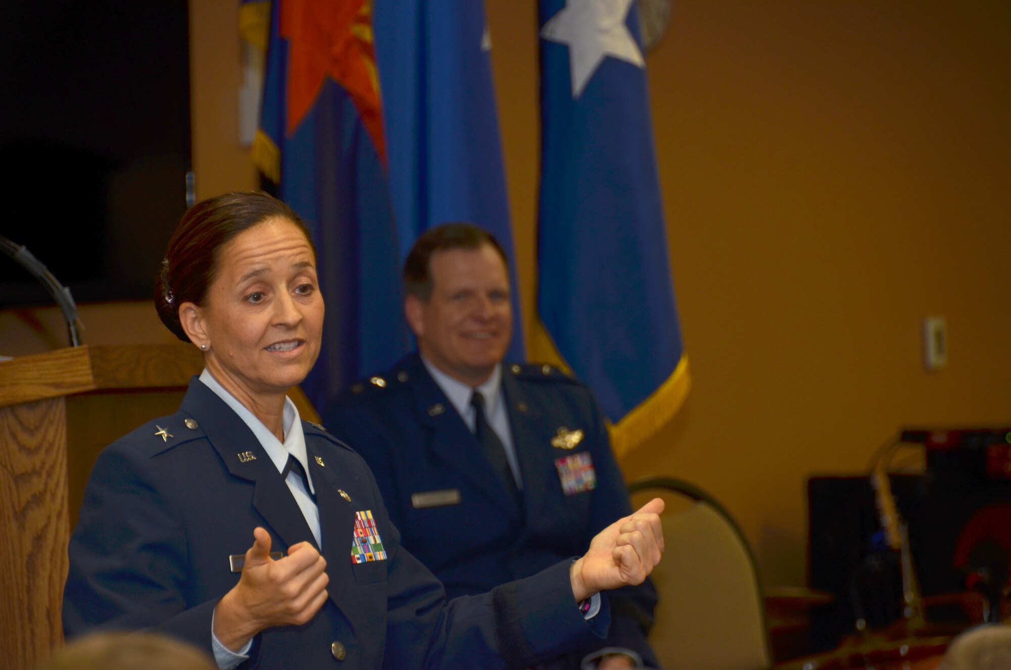U.S. Air Force Brig. Gen. Kerry L. Muehlenbeck, Arizona Army and Air Guard Joint Operations officer,  laughs with the audience during her promotion ceremony June 7, 2014 at the 161st Air Refueling Wing, Phoenix. “The military is a big part of me – but it’s not all of me. I’ve tried to balance all aspects of my life over the years,” said Muehlenbeck. (U.S. Air National Guard photo by Senior Airman Rashaunda Williams/Released)