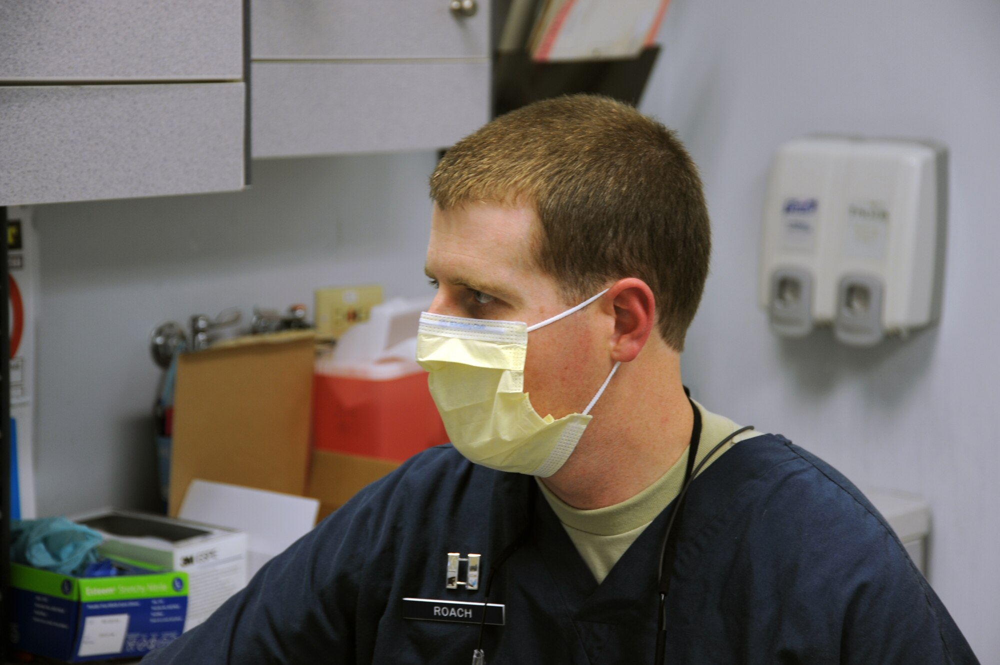 POPE ARMY AIRFIELD, N.C. - Capt. Bryan Roach, 440th Medical Squadron dentist here, prepares to review a patient’s dental X-ray records.  Roach is part of a team of specialists from the 440th MDS selected to support Tropic Care 2014 in Kauai, Hawaii. While providing free health care services for medically underserved island residents, Tropic Care also helps prepare reservists for rapid deployment and readiness training.  (U.S. Air Force photo by Tech. Sgt. Elizabeth Moody)