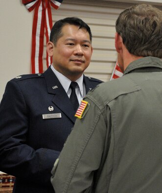 Lt. Col. Michael Bautista, 97th Airlift Squadron commander, speaks with a guest at his change of command ceremony reception June 8 at Joint Base Lewis-McChord - McChord Field, Washington. In addition to the ceremony, personnel from the 97th AS also celebrated its 71st birthday at a local restaurant in Tacoma, Washington. (U.S. Air Force Reserve photo by Tech. Sgt. Minnette Mason)