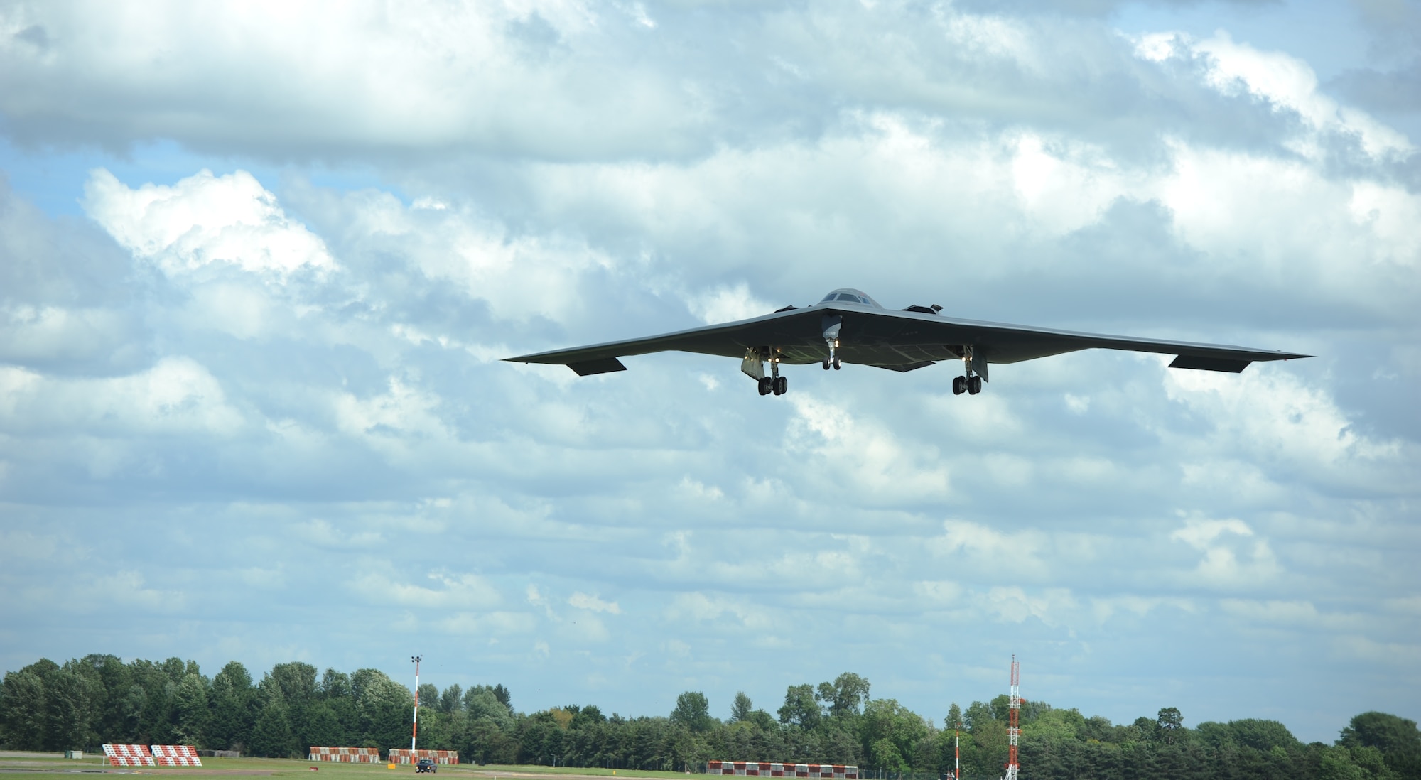 A B-2 Spirit from the 509th Bomb Wing, Whiteman Air Force Base, Missouri, prepares to land on the runway at RAF Fairford, England, June 8, 2014. The B-2 Spirit is a multi-role bomber capable of delivering both conventional and nuclear munitions. (U.S. Air Force photo by Staff Sgt. Nick Wilson/Released)