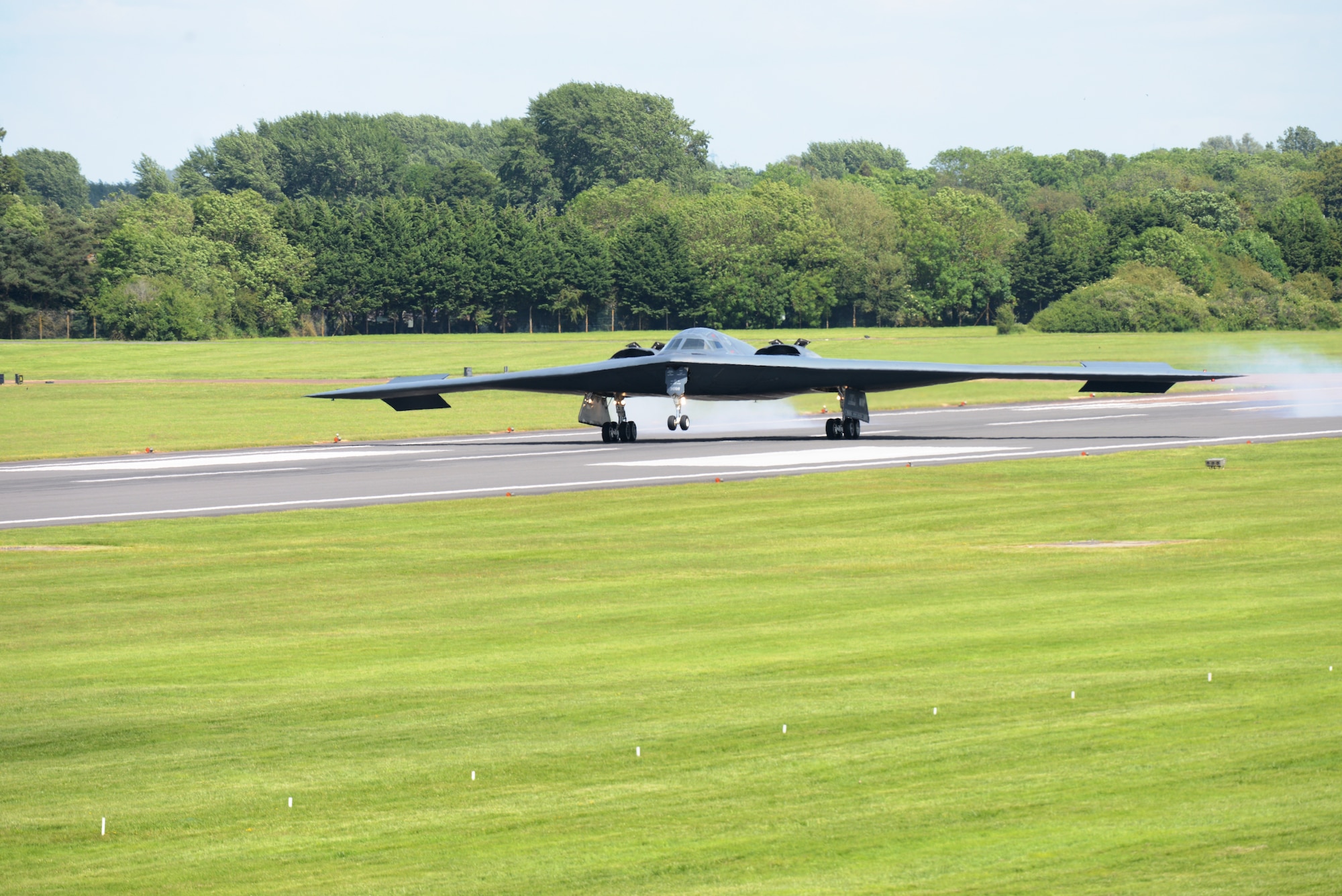 A B-2 Spirit from the 509th Bomb Wing, Whiteman Air Force Base, Mo., lands on the runway at RAF Fairford, England, June 8, 2014. The B-2’s low-observable, or "stealth," characteristics give it the unique ability to penetrate an enemy's most sophisticated defenses and threaten its most valued, and heavily defended, targets. (U.S. Air Force photo by Tech. Sgt. Chrissy Best/Released)