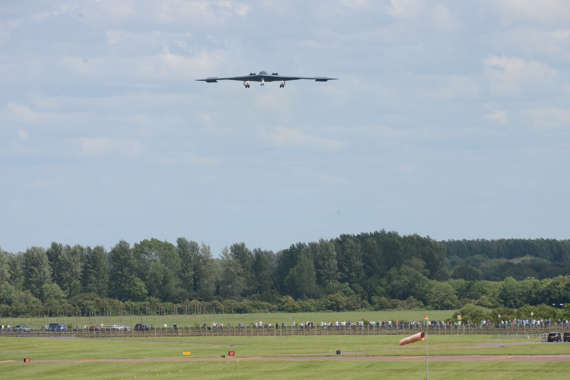 A B-2 Spirit from the 509th Bomb Wing, Whiteman Air Force Base, Missouri, prepares to land on the runway at RAF Fairford, England, June 8, 2014. The B-2 Spirit is a multi-role bomber capable of delivering both conventional and nuclear munitions. (U.S. Air Force photo by Tech. Sgt. Chrissy Best/Released)