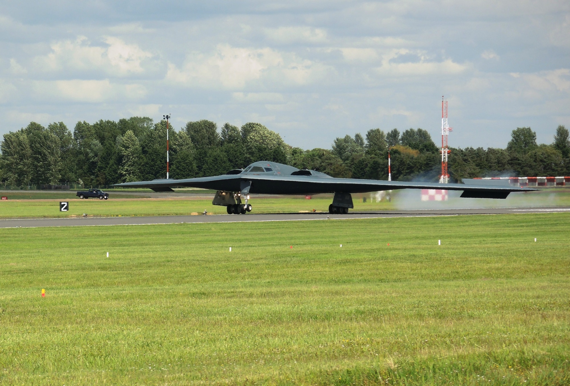 A B-2 Spirit from Whiteman Air Force Base, Missouri, lands at RAF Fairford, England June 8, 2014. Two B-2 Spirits from Whiteman flew to the U.S. European Command area of to train and integrate with U.S. and allied military forces in the region. (U.S. Air Force photo by Candy Knight/Released)