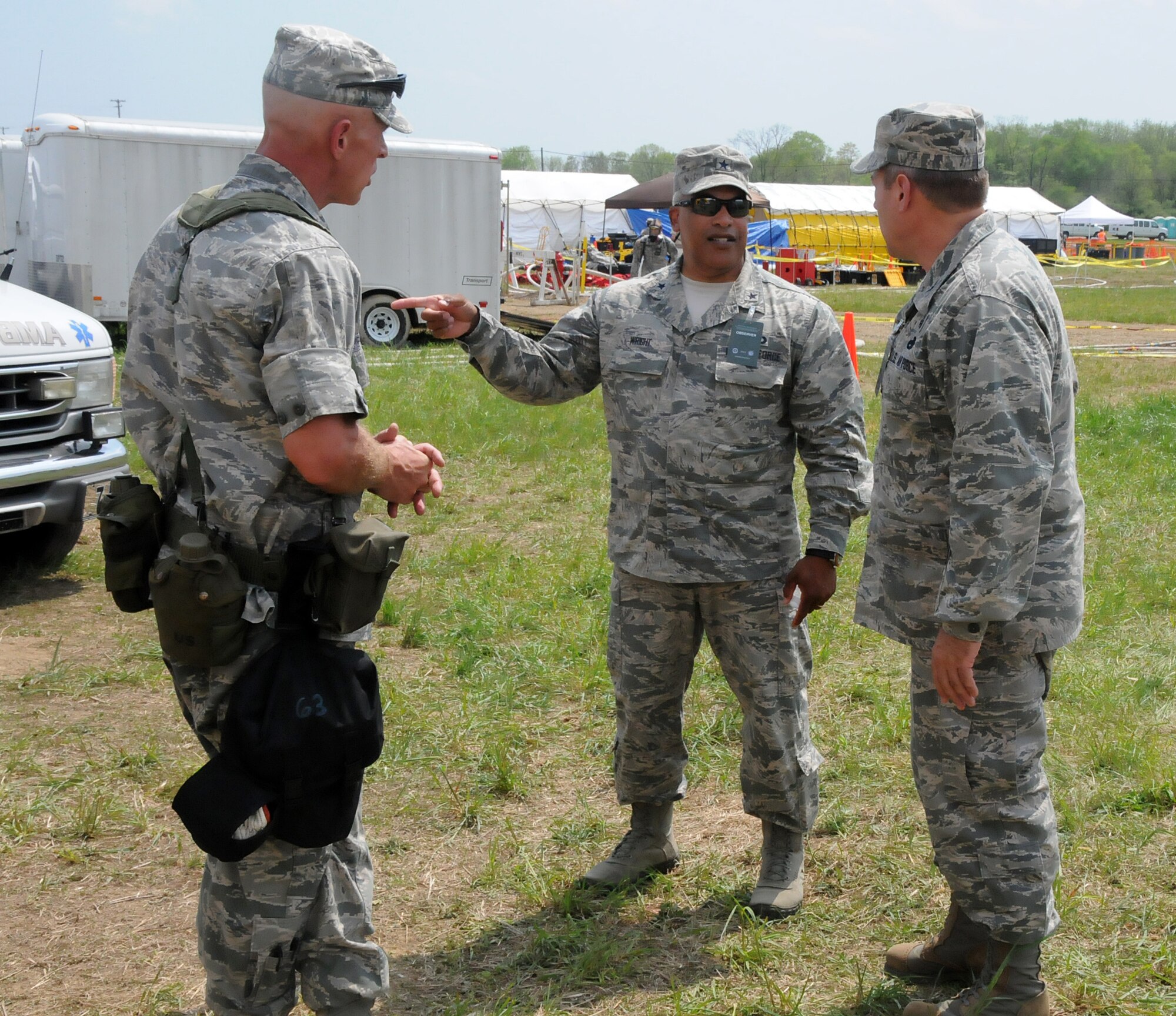 Brig. Gen. Wayne A. Wright, Virginia National Guard Chief of Staff (center), observes the Vigilant Guard exercise in which the 192nd MDG participated in to enhance their Chemical, Biological, Radiological, Nuclear, and Explosive (CBRNE) Enhanced Response Force Package (CERFP) training, at Fort Indiantown Gap, Pa., May 13, 2014. The CERFP conducts tasks associated with incident management, search and rescue, mass casualty decontamination, medical triage, and fatality recovery. (U.S. Air National Guard photo by Airman 1st Class Johnisa B. Roberts/Released)