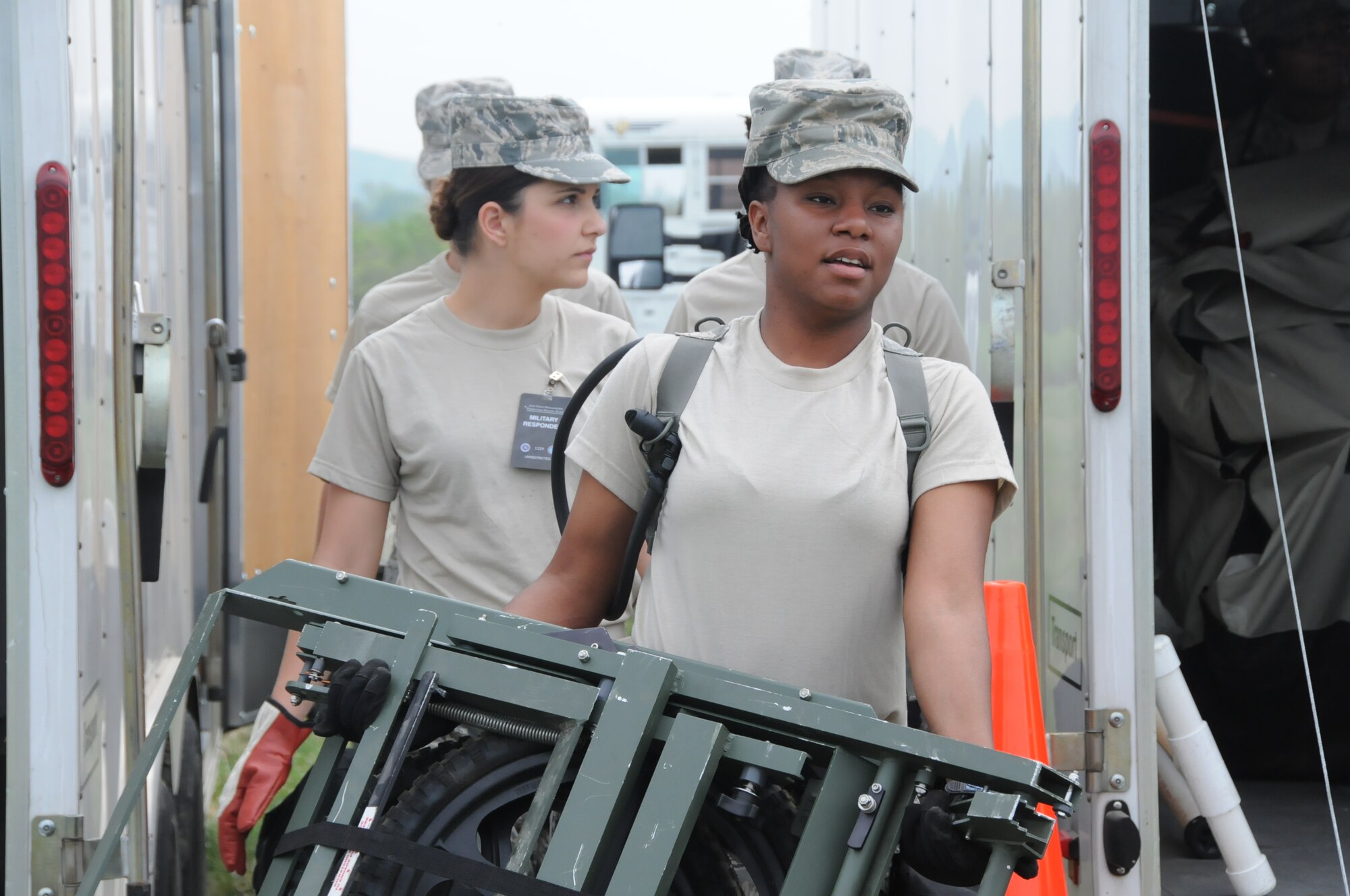 Airman 1st Class LaToya Patterson, 192nd Fighter Wing Medical Group public health specialist, carries litter equipment during the three-day Vigilant Guard exercise in which the 192nd MDG participated in to enhance their Chemical, Biological, Radiological, Nuclear, and Explosive (CBRNE) Enhanced Response Force Package (CERFP) training at Fort Indiantown Gap, Pa., May 13, 2014.  The CERFP conducts tasks associated with incident management, search and rescue, mass casualty decontamination, medical triage, and fatality recovery.  (U.S. Air National Guard photo by Airman 1st Class Johnisa B. Roberts/Released)