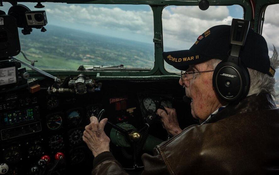 Bill Prindible, a veteran U.S. Army pilot who flew on D-Day, takes the controls of a C-47 Skytrain during a flight over Normandy, June 5, 2014. Bill Prindible was visiting Normandy as part of the 70th Anniversary of the Invasion of Normandy. Over 60 Ramstein Airmen have traveled to Normandy, France to celebrate and honor the sacrifices made by veterans of World War II. (U.S. Air Force photo/Airman 1st Class Jordan Castelan)