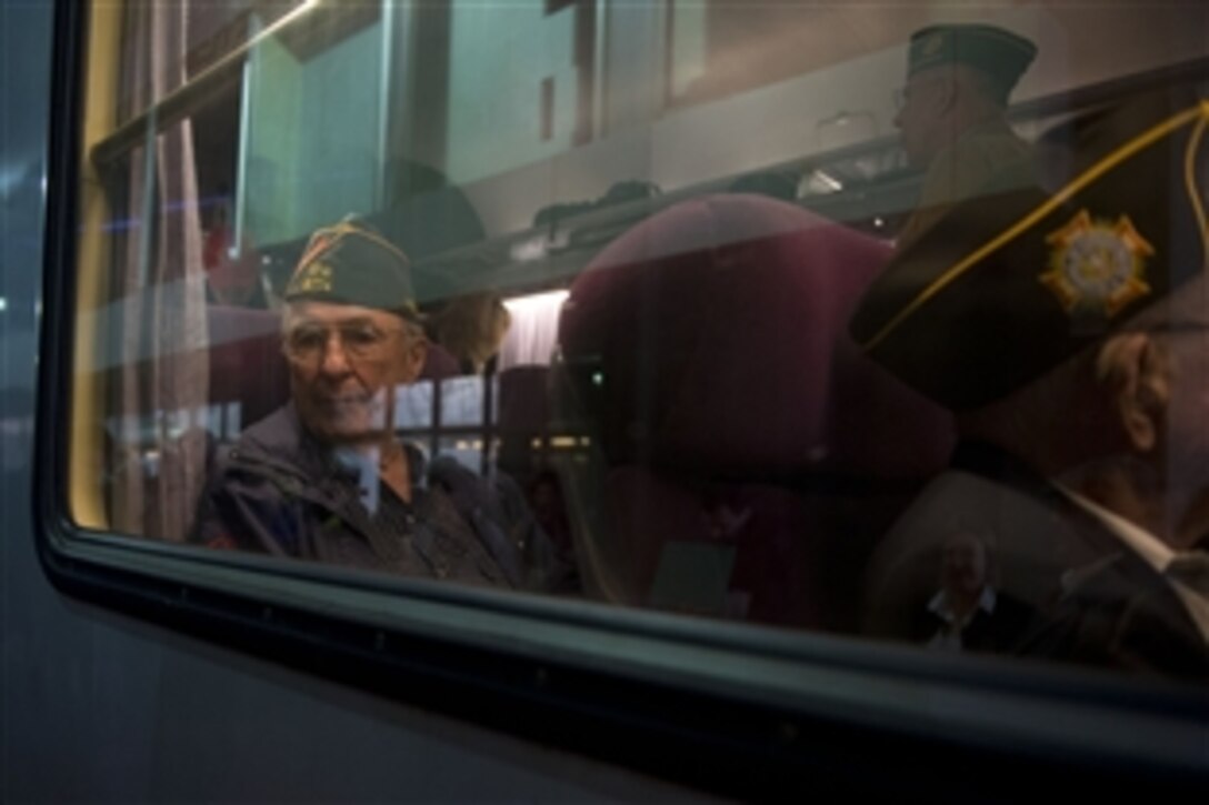 Veterans from several nations board the train on their way to the 70th anniversary commemoration of D-Day at Omaha Beach in Normandy, France, June 6, 2014. 