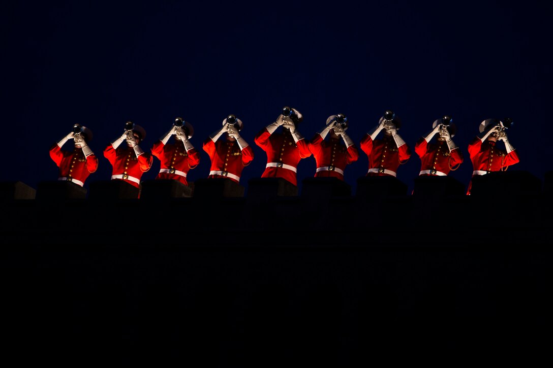 The U.S. Marine Drum & Bugle Corps performs during a Friday Evening Parade at Marine Barracks Washington, D.C., June 6, 2014. (Official Marine Corps photo by Cpl. Dan Hosack/Released)