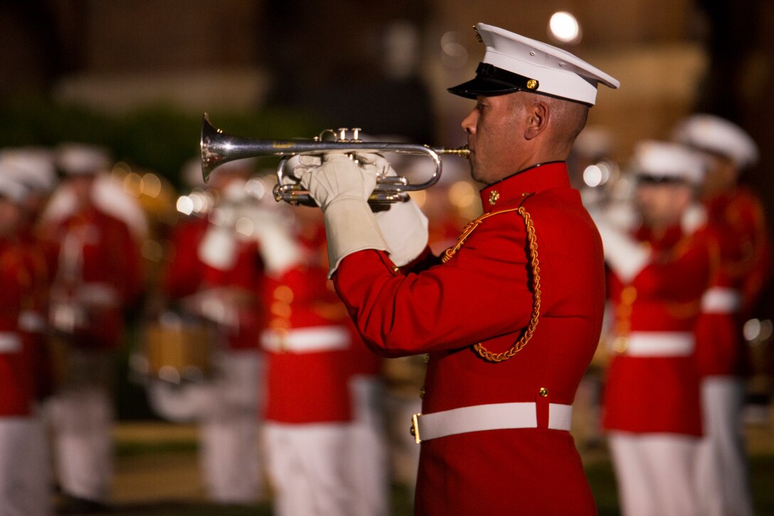 The U.S. Marine Drum & Bugle Corps performs during a Friday Evening Parade at Marine Barracks Washington, D.C., June 6, 2014. (Official Marine Corps photo by Cpl. Larry Babilya/Released)