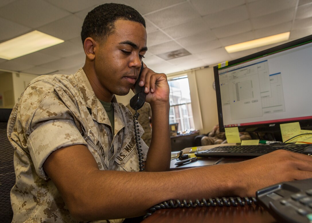 U.S. Marine Corps Cpl. Marque L. Avery, a supply clerk assigned to the 26th Marine Expeditionary Unit, works in his office at the unit's command post aboard Camp Lejeune, N.C., June 5, 2014. Avery is currently transitioning out of the Marine Corps after four years of honorable service. Avery is a native of Cleveland and plans to go to school at Cleveland State University. (U.S. Marine Corps photo by Lance Cpl. Joshua W. Brown/Released)