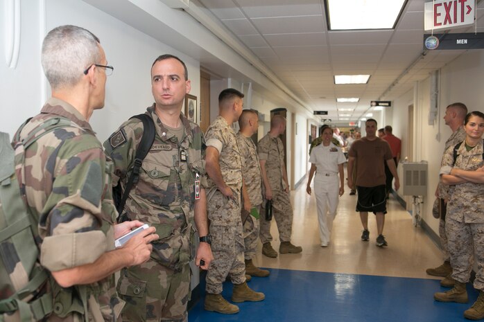 Joint Expeditionary Base Little Creek (May 29, 2014) - Lt. Col. Emmanuel Deveaud, a soldier with the France 6th Armored Brigade, speaks with a colleague during a break at the Bold Alligator 2014 (BA14) mid-planning conference hosted by Expeditionary Warfare Training Group, Atlantic. The exercise series will bring together coalition partners from six continents, demonstrating the Navy-Marine Corps team's flexibility of naval forces and amphibious warfare expertise by interaction with coalition partners.  

This exercise will address the ability to respond to  crisis and the refinement of Expeditionary Strike Group Two (Navy and Marine Corps) and the Second Marine Expeditionary Brigade staffs' ability to composite forward deployed and follow on forces in order to conduct multiple operations in an uncertain threat environment. 

Bold Alligator 2014 is scheduled to take place Oct. 29 through Nov. 8th.
