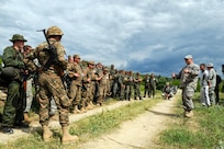 Army 1st Lt. Scott Mathewson, from the Vermont Army National Guard, provides After Action Reporting comments to American, Armenian, Belarusian and Macedonian soldiers at the Krivolak Training Area in the Former Yugoslav Republic of Macedonia, The Soldiers had the opportunity to train together during Exercise Cooperative Lancer, improving capabilities and fostering international partnerships.