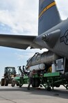 Members of the 153rd Airlift Wing load a U.S. Forest Service Modular Airborne Firefighting System II onto a C-130 Hercules aircraft in support of operations suppressing wildfires in Colorado. Working out of Peterson Air Force Base, Colo., the more than 65,000 gallons of retardant have been dropped by crews from the 153rd AW and 302nd Airlift Wing on the Waldo Canyon wildfire.