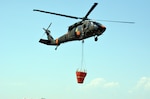 Soldiers with the Colorado Army National Guard's C Company, 2nd Battalion, 135th Aviation Regiment take off from Fort Collins/Loveland Municipal Airport in Colorado, as part of a mission in support of fighting Colorado's High Park wildfire. Aircrews from the unit have recently been transitioned over to fighting the Waldo Canyon, Colo., wildfire as well.