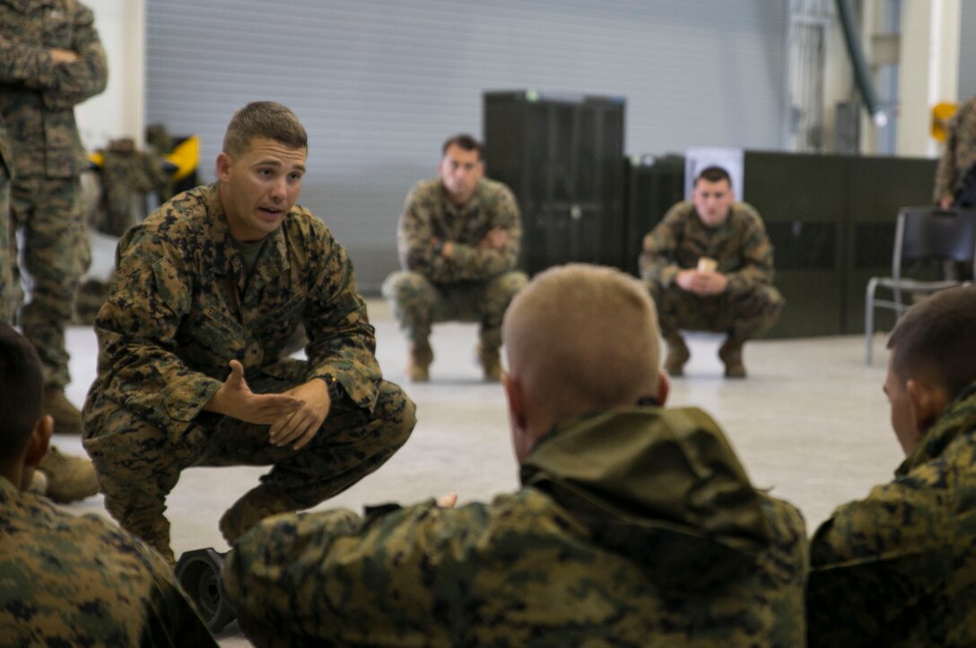 Staff Sgt. Eric J. Ellenberger, left, discusses the proper use of the AT4 rocket launcher June 5 on Camp Mujuk, South Korea. The period of instruction familiarized U.S. Marines with crew served weapons to enhance safety on ranges where they will be training Republic of Korea Marines as part of the Korean Marine Exchange Program 14-8. KMEP 14-8 is one iteration in a series of continuous combined training exercises designed to enhance the ROK-U.S. alliance, promote stability on the Korean Peninsula, and strengthen ROK-U.S. military capabilities and interoperability. Ellenberger is a military policeman with 3rd Law Enforcement Battalion, III Marine Expeditionary Force Headquarters Group, III MEF. (U.S. Marine Corps photo by Lance Cpl. Drew Tech/Released)