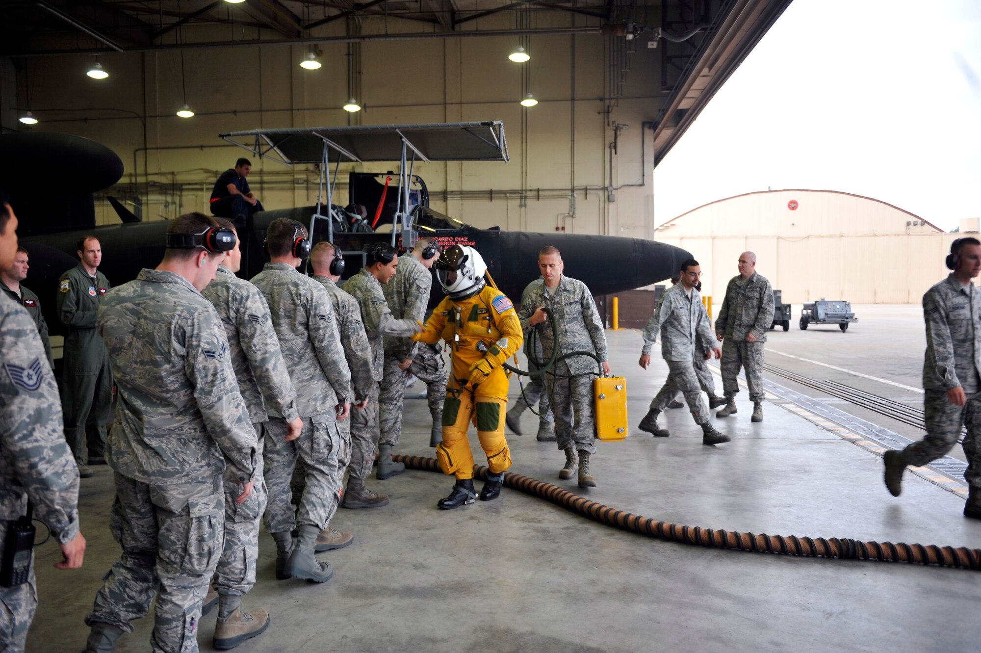 Members of the 5th Reconnaissance Squadron line up to shake the hand of a 5th RS pilot before he enters the cockpit of a U-2 Dragon Lady on Osan Air Base, Republic of Korea, June 5, 2014. Each U-2 mission lasts from six to 10 hours. (U.S. Air Force photo/Senior Airman David Owsianka)