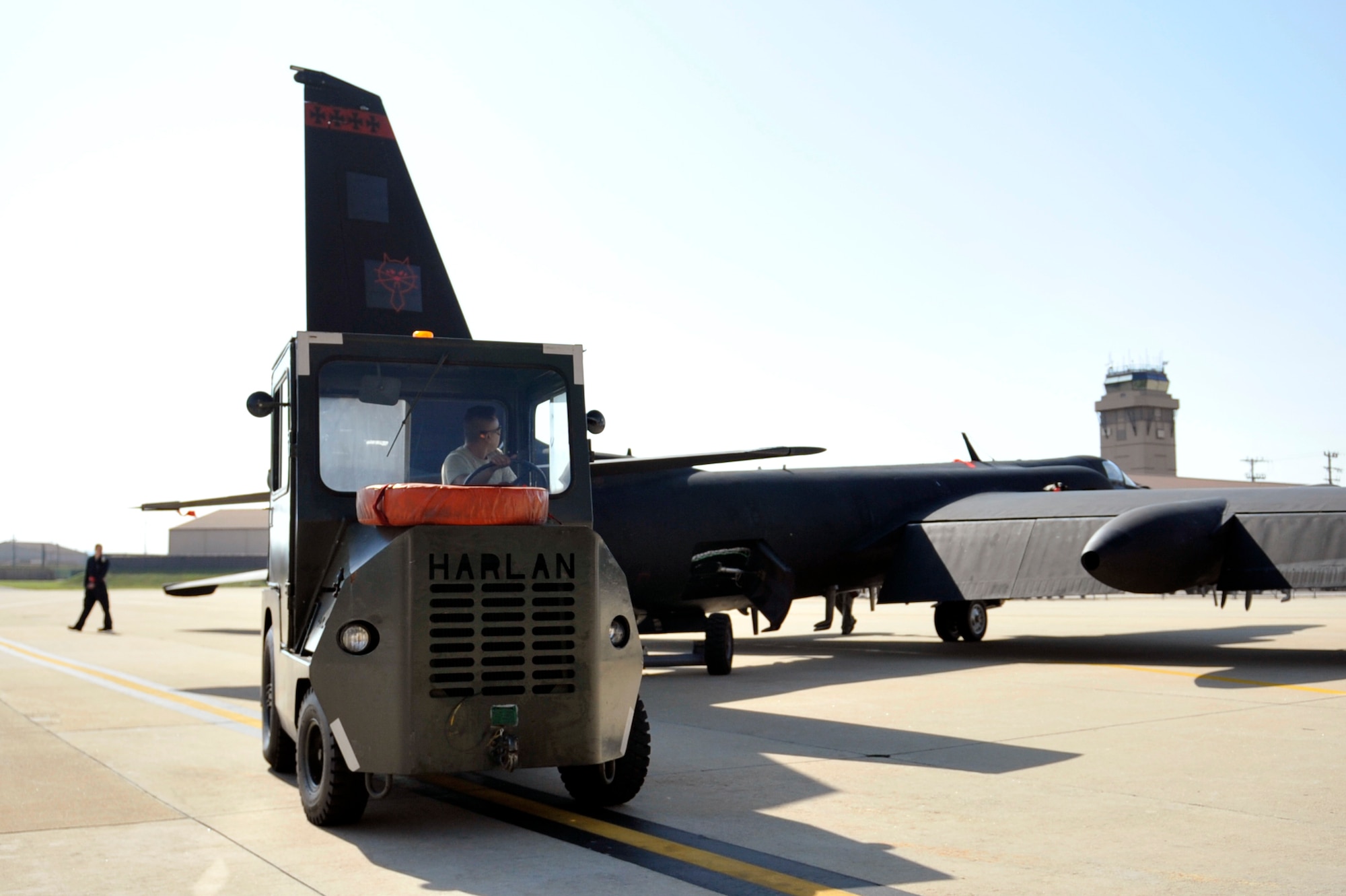 Airman 1st Class Johnny Ninh, 5th Reconnaissance Squadron crew chief, tows a recovered U-2 Dragon Lady into a hangar for maintenance on Osan Air Base, Republic of Korea, May 15, 2014. Crew chiefs then perform post-flight inspection to ensure the aircraft would be structurally fit for its next flight. (U.S. Air Force photo/Senior Airman David Owsianka)