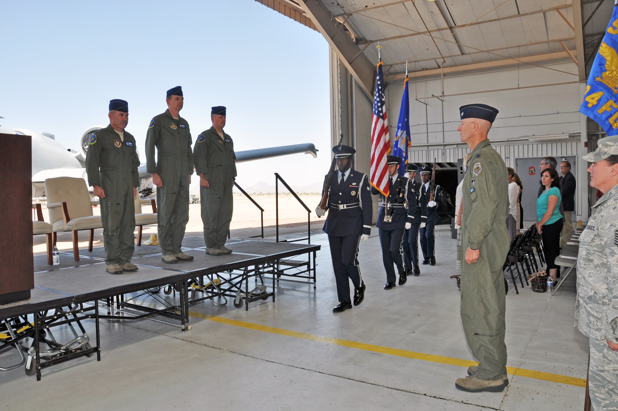 Honor Guard members march in to present the colors during the 924th Fighter Group Change of Command. During the ceremony Col. Thomas McNurlin became assumed command from Col. John Russell in a ceremony officiated by Col. Kurt J. Gallegos, 944th Fighter Wing commander. (U.S. Air Force photo/Maj. Elizabeth Magnusson)
