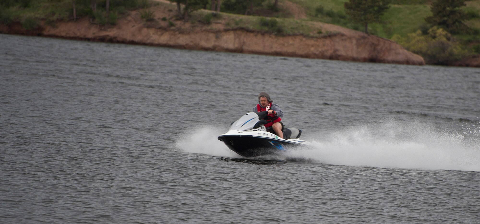 140608-F-GZ967-012 Roy Hinson, Outdoor Recreation employee, cruises along the Granite Springs Reservoir, Curt Gowdy State Park, Wyo., May 8.  (U.S. Air Force photo by Airman 1st Class Brandon Valle) 