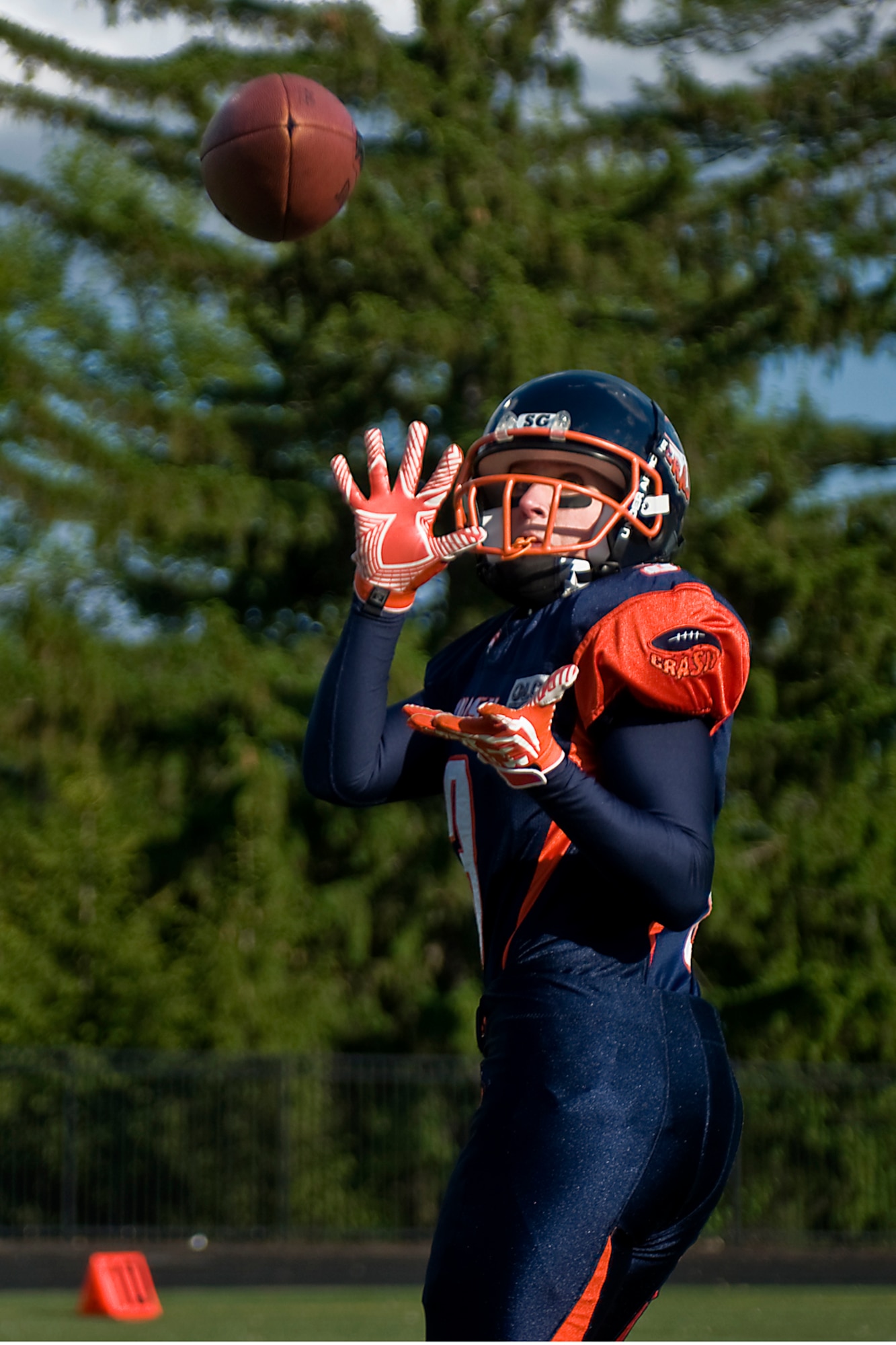 Leslie Nance, Indy Crash tight end, catches a pass while warming up for a football game in Indianapolis May 17, 2014. Nance is also a 445th Aeromedical Staging Squadron first sergeant at Wright-Patterson Air Force Base, Ohio, and a civilian 434th Force Support Squadron human resources specialist at Grissom Air Reserve Base, Ind. (U.S. Air Force photo/Tech. Sgt. Mark R. W. Orders-Woempner)

