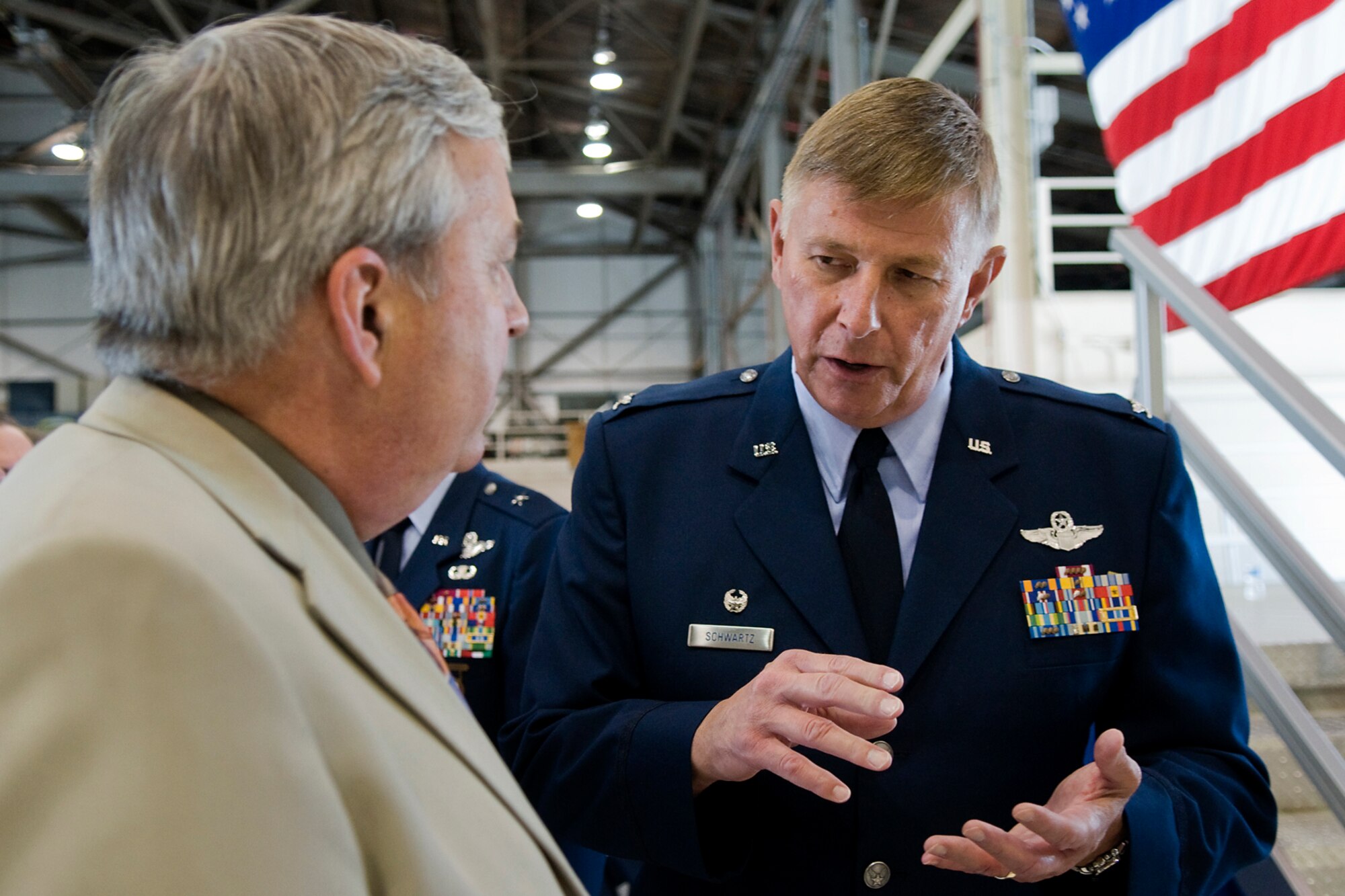 Col. Doug Schwartz, 434th Air Refueling Wing commander, right, talks with retired Brig. Gen. Dean Despinoy following Schwartz's assumption of command ceremony at Grissom Air Reserve, Base, Ind., June 8, 2014. Despinoy previously served as the 434th ARW commander prior to his retirement and is now a member of the Grissom Community Council. (U.S. Air Force photo/Tech. Sgt. Mark R. W. Orders-Woempner )
