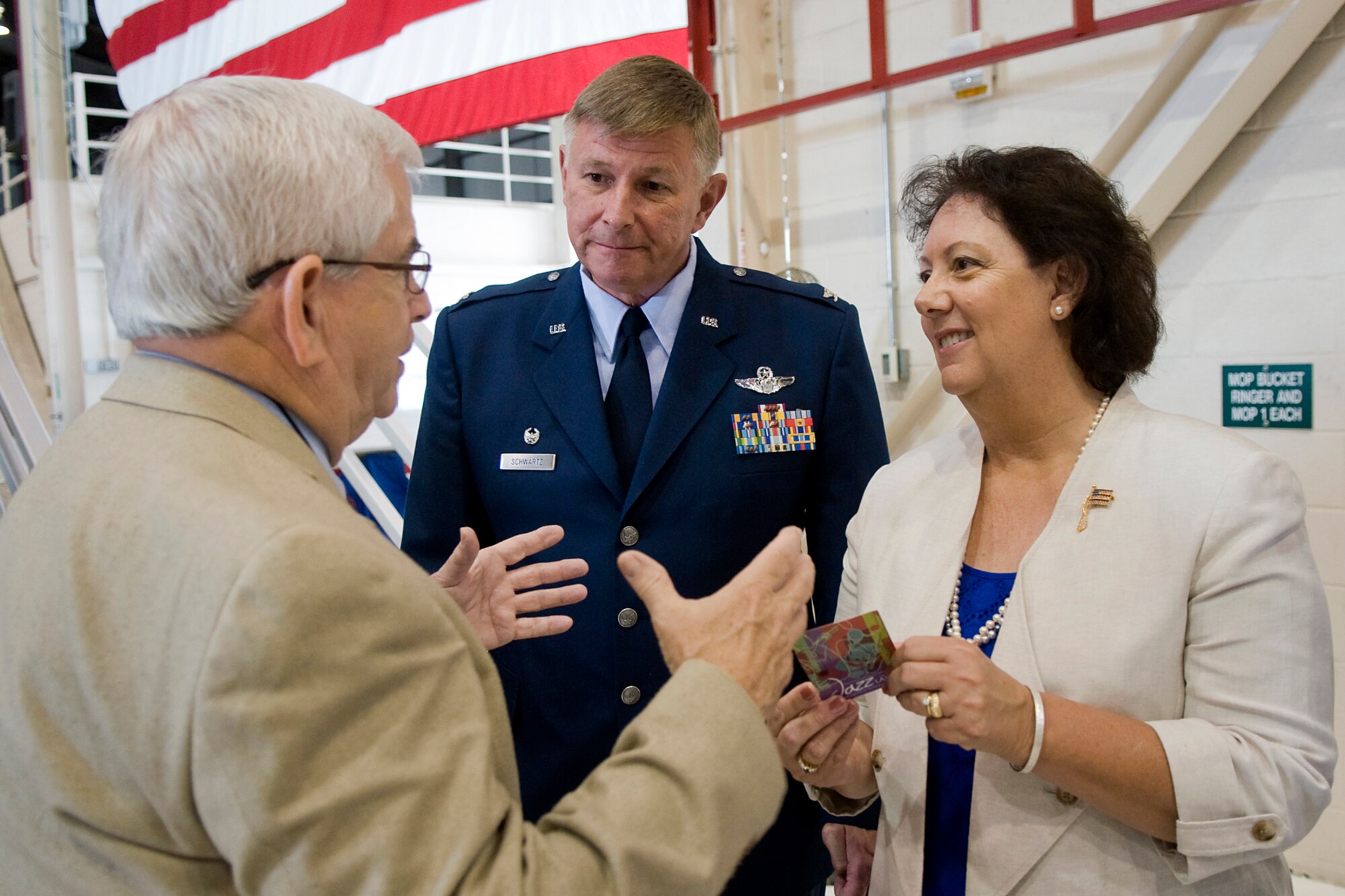 Hal Job, Grissom Community Council Wabash regional director, left, talks with Col. Doug Schwartz, 434th Air Refueling Wing commander, and his wife, Ann, shortly after Schwartz assumed command of the Hoosier Wing at Grissom Air Reserve, Base, Ind., June 8, 2014. During the ceremony, Schwartz affirmed his commitment to keeping the base relevant when addressing community leaders. (U.S. Air Force photo/Tech. Sgt. Mark R. W. Orders-Woempner )
