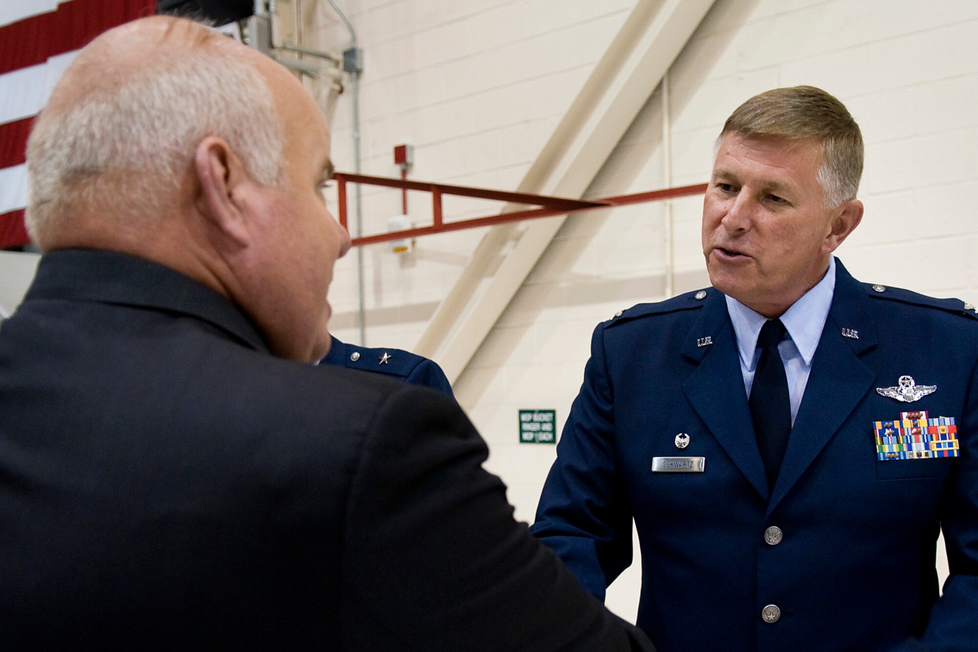 Jim Tidd, Miami County Economic Development Authority director, left, talks with Col. Doug Schwartz, 434th Air Refueling Wing commander, shortly after the colonel assumed command of the Hoosier Wing at Grissom Air Reserve, Base, Ind., June 8, 2014. During the ceremony, Schwartz affirmed his commitment to keeping the base relevant when addressing community leaders. (U.S. Air Force photo/Tech. Sgt. Mark R. W. Orders-Woempner)
