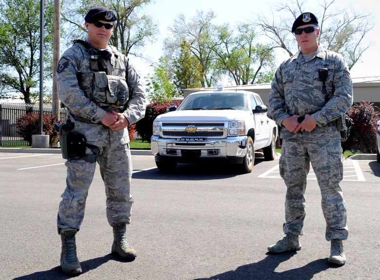 Master Sgt. Jonathan Krueger and Tech. Sgt. Jeremy Oates, 366th Security Forces Squadron flight chiefs, pose for a photo outside the 366th SFS, May 22, 2014, at Mountain Home Air Force Base, Idaho. On May 6th the two defenders responded to the scene of an unresponsive individual, resulting in the collaboration of base agencies and a life saved. (U.S. Air Force photo by Senior Airman Caitlin Guinazu/ RELEASED) 
