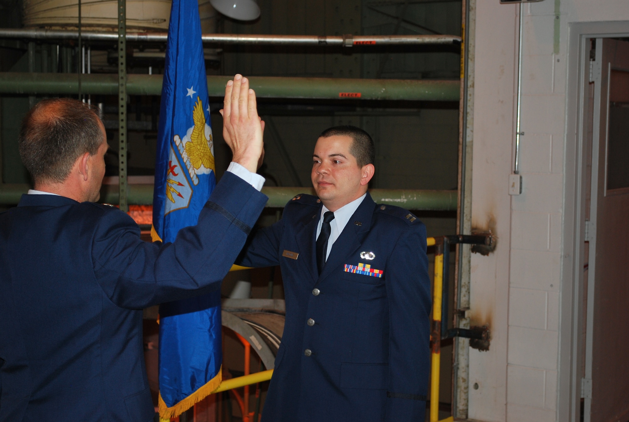 Capt. Paul Malone (right) takes his Oath of Office during his promotion ceremony where he was promoted to captain in the U.S. Air Force. The oath was presented by Lt. Col. Jay Orson. (Photo provided)